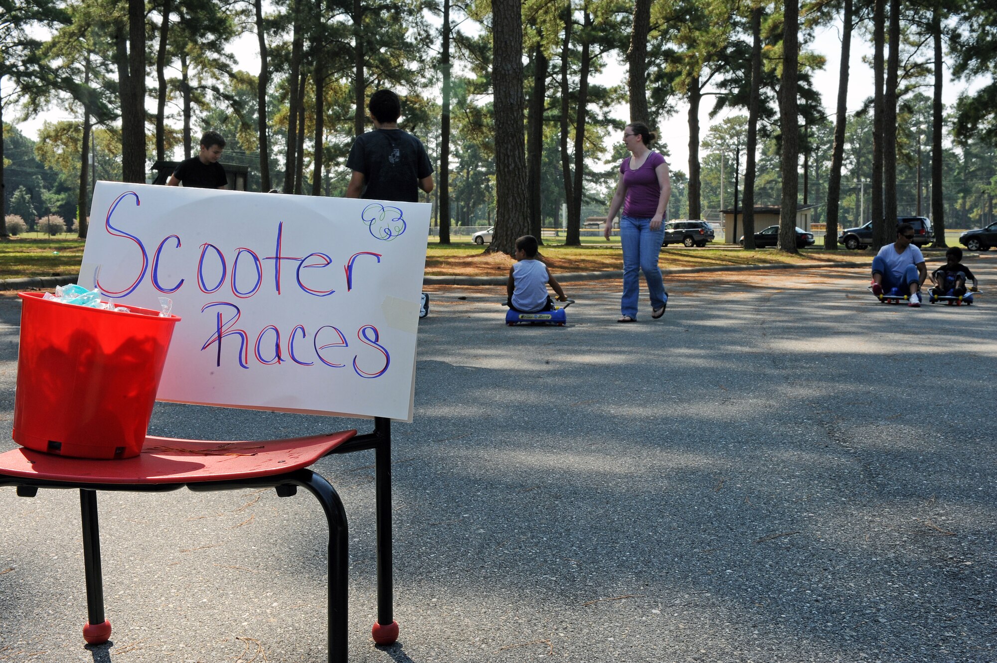 Children participate in a scooter race during the Worldwide Day of Play on Seymour Johnson Air Force Base, N.C., Sept. 22, 2012. More than 300 members of Team Seymour participated in a variety of activities such as potato sack races, checkers and tug-o-war contests at the event. (U.S. Air Force photo/Airman 1st Class John Nieves Camacho/Released)