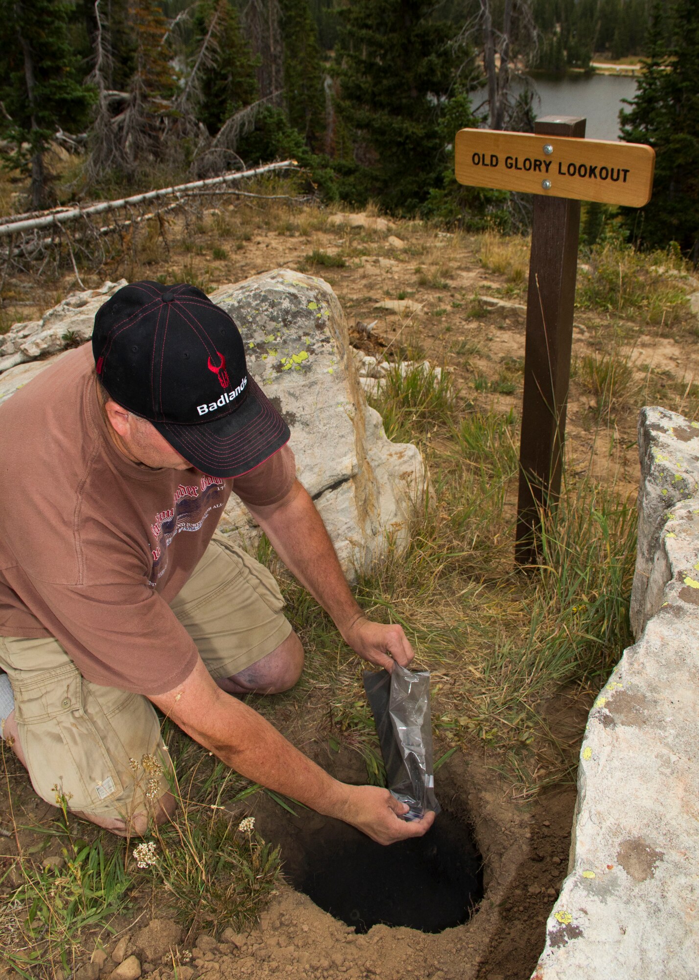 Master Sgt. Dave Graham, 419th Medical Squadron, buries the flag ashes he’s collected for five years. Title 4 of the United States Code states an unserviceable American flag should be burned and disposed of with respect. Groups such as the American Legion and Boy Scouts of America have long practiced burying flag ashes in remote areas. (U.S. Air Force photo/Tech. Sgt. Richard Gonzales)