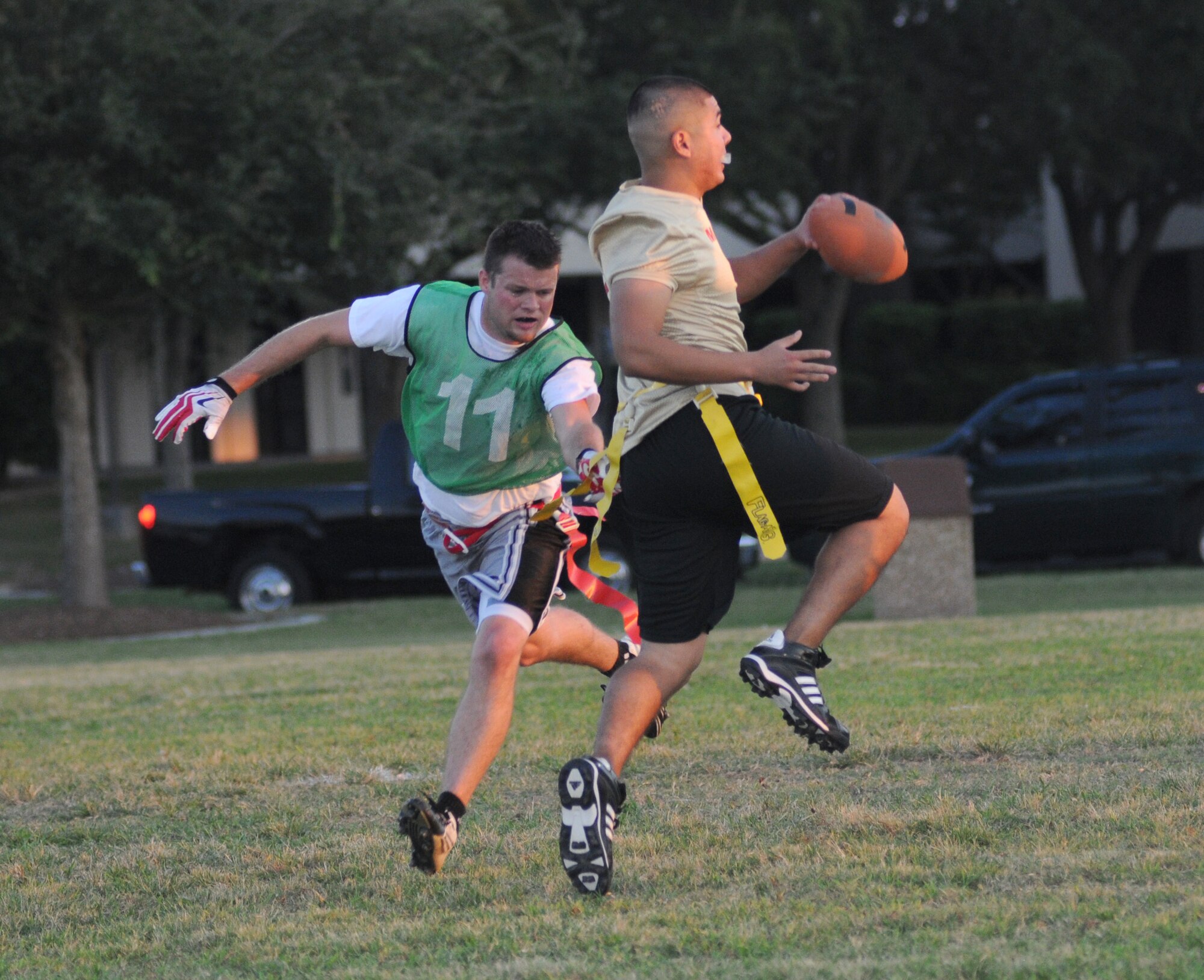 Matt Mitchell,  81st Surgical Operations Squadron, grabs the flag of Carlos Macias, Keesler Marine Detachment, as he makes a run towards the end zone during an intramural flag football game Sept. 19, 2012, at Keesler Air Force Base, Miss.  MARDET defeated the 81st MSGS, 13-0.  (U.S. Air Force photo by Kemberly Groue)