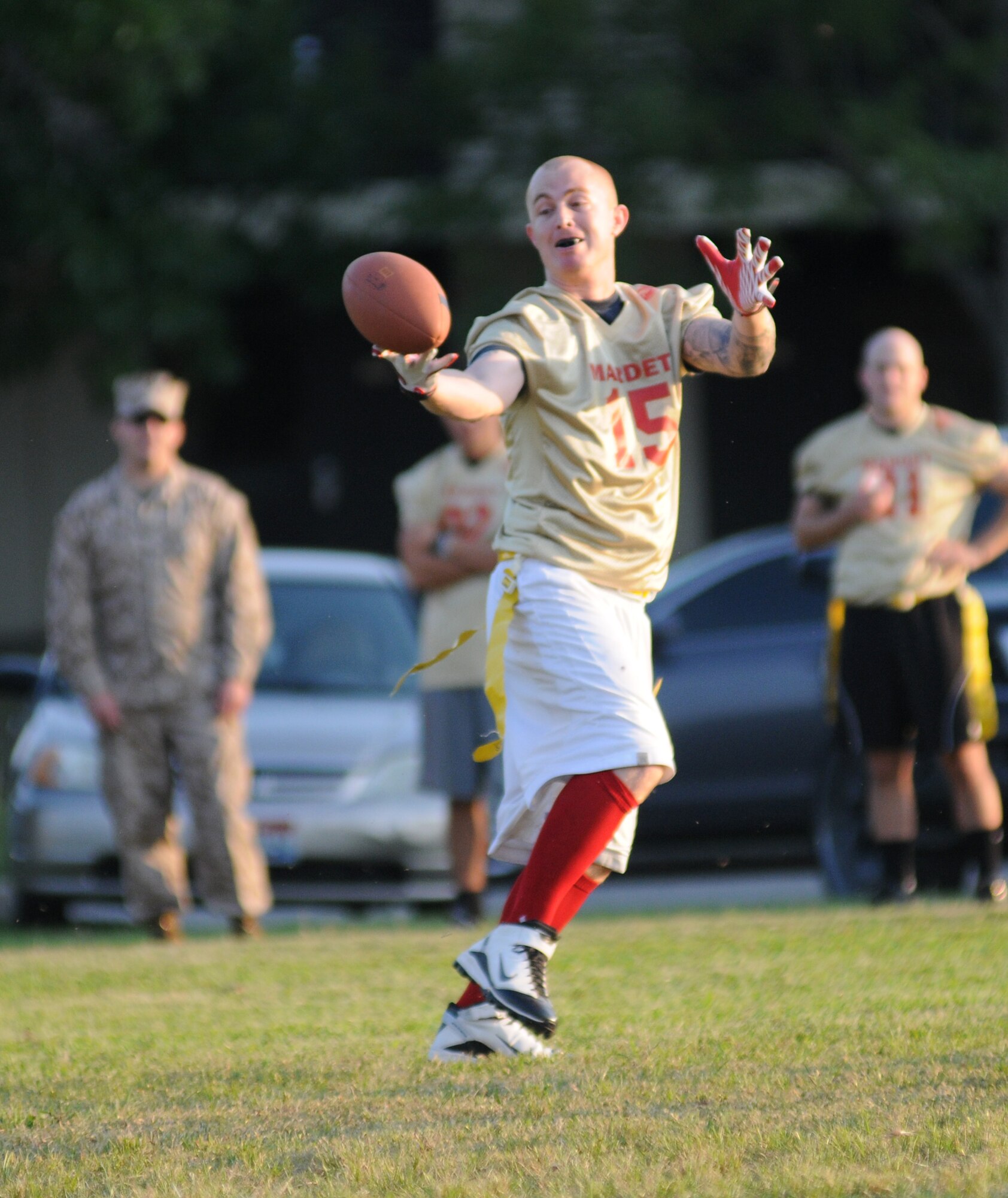 Kevin Evick, Keesler Marine Detachment, reaches to make the catch during an intramural flag football game against the 81st Surgical Operations Squadron, Sept. 19, 2012, at Keesler Air Force Base, Miss.  MARDET defeated the 81st MSGS, 13-0.  (U.S. Air Force photo by Kemberly Groue)
