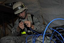 U.S. Air Force Airman 1st Class Matthew Carlson, 4th Communications Squadron network operations technician, rewires a local area network cable during Phase II of Operational Readiness Exercise Coronet Warrior 12-04 at a simulated deployed location on Seymour Johnson Air Force Base, N.C., Sept. 20, 2012. OREs test an Airman's ability to operate in a contested environment. (U.S. Air Force photo/Airman 1st Class John Nieves Camacho/Released)