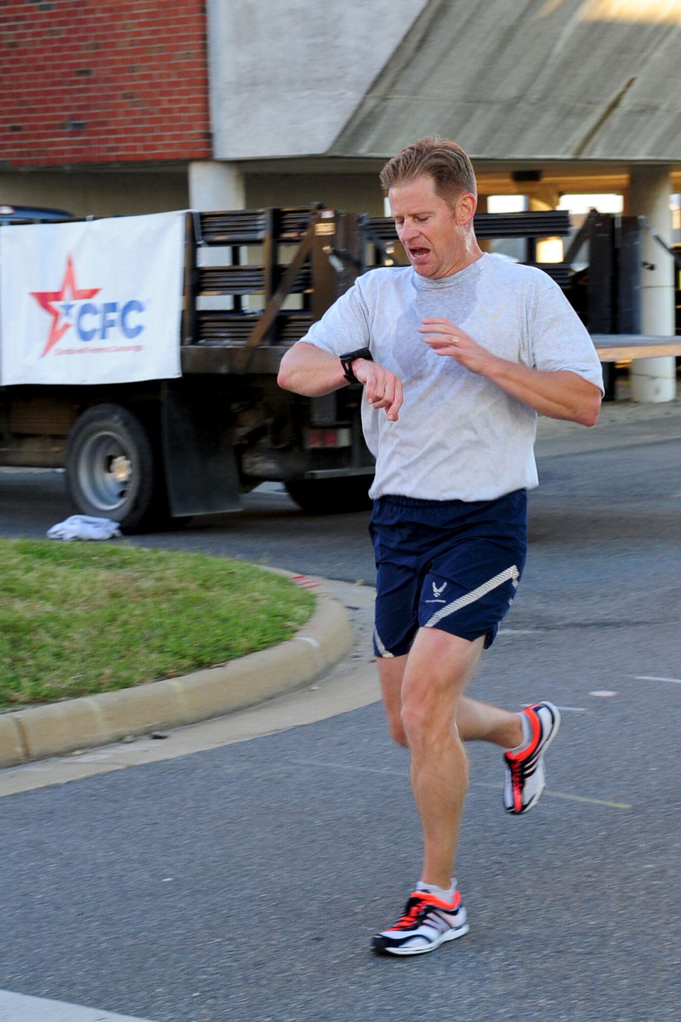 U.S. Air Force Lt. Col. Severin Blenkush, Air Combat Command Acquisition Management and Integration Center deputy director, finishes third during the annual Combined Federal Campaign 5K run at Langley Air Force Base, Va., Sept. 25, 2012. The 5K kicked off the annual campaign, in which donors raise millions of dollars, with nearly 25 percent of total contributions going toward the Virginia Peninsula area. (U.S. Air Force photo by Staff Sgt. Ashley Hawkins/Released)