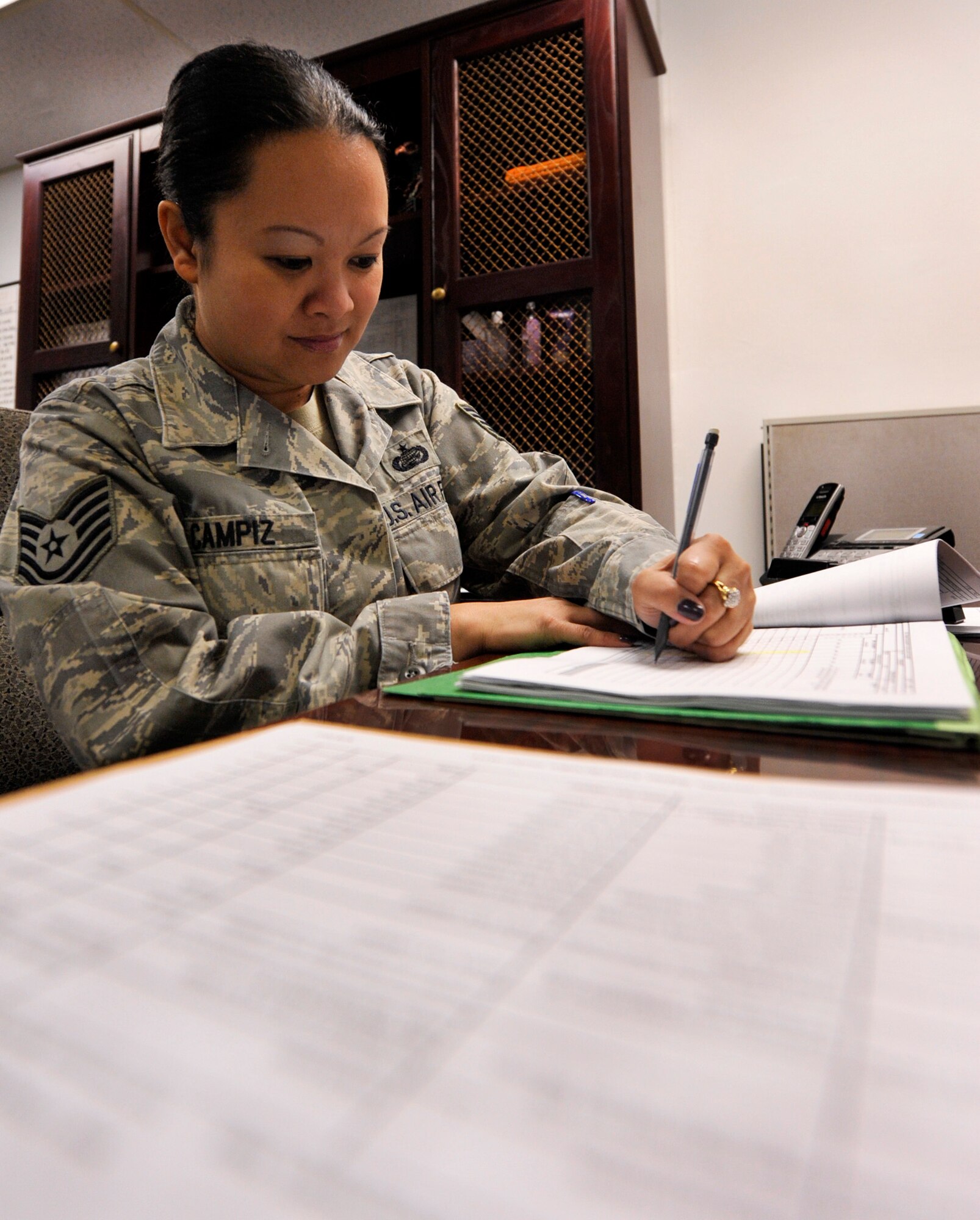Tech. Sgt. Carol Campiz, a 19th Maintenance Operations Squadron maintenance training flight scheduler, processes an Air Force form 898 Field Training Detachment course for C-130's Sept. 19, 2012, at Little Rock Air Force Base, Ark. Campiz schedules over 6,000 training classes annually including two Air Mobility Command contracted engine run courses. (U.S. Air Force photo by Airman 1st Class Rusty Frank)