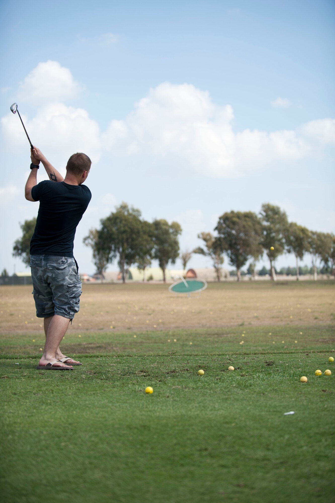 Senior Airman Devon Cross, 39th Comptroller Squadron, competes in a challenge during Incirlik's Amazing Race Sept. 22, 2012, at Incirlik Air Base, Turkey. Eight teams traveled across the base and into parts of Adana accomplishing various challenges while competing for first place. The event kicked off Incirlik's Combined Federal Campaign with all team fees going to charity. (U.S. Air Force photo by Senior Airman Clayton Lenhardt/Released)