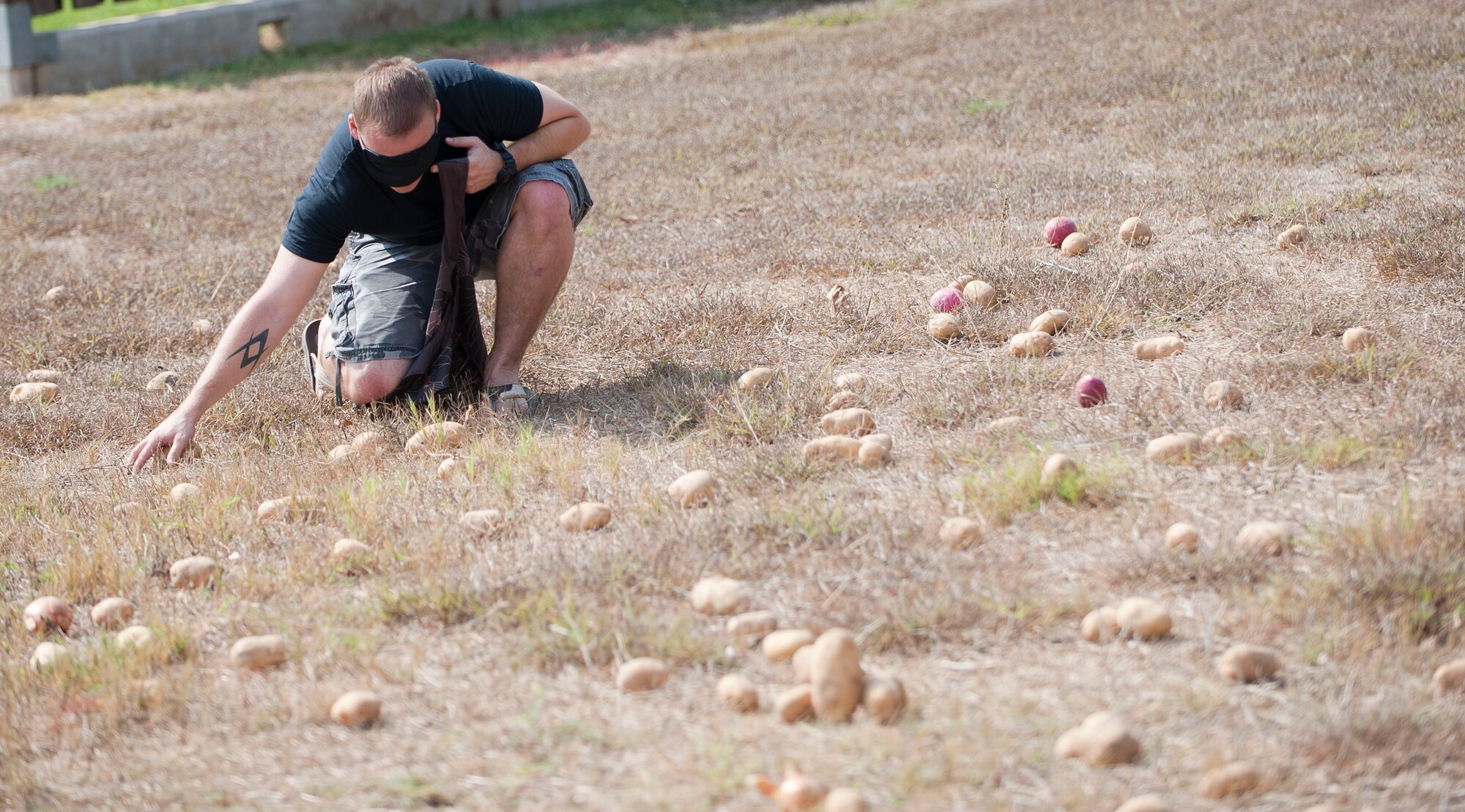 Senior Airman Devon Cross, 39th Comptroller Squadron, fills a sack with potatoes as part of a challenge during Incirlik's Amazing Race Sept. 22, 2012, at Incirlik Air Base, Turkey. Eight teams traveled across the base and into parts of Adana accomplishing various challenges while competing for first place. The event kicked off Incirlik's Combined Federal Campaign with all team fees going to charity. (U.S. Air Force photo by Senior Airman Clayton Lenhardt/Released)