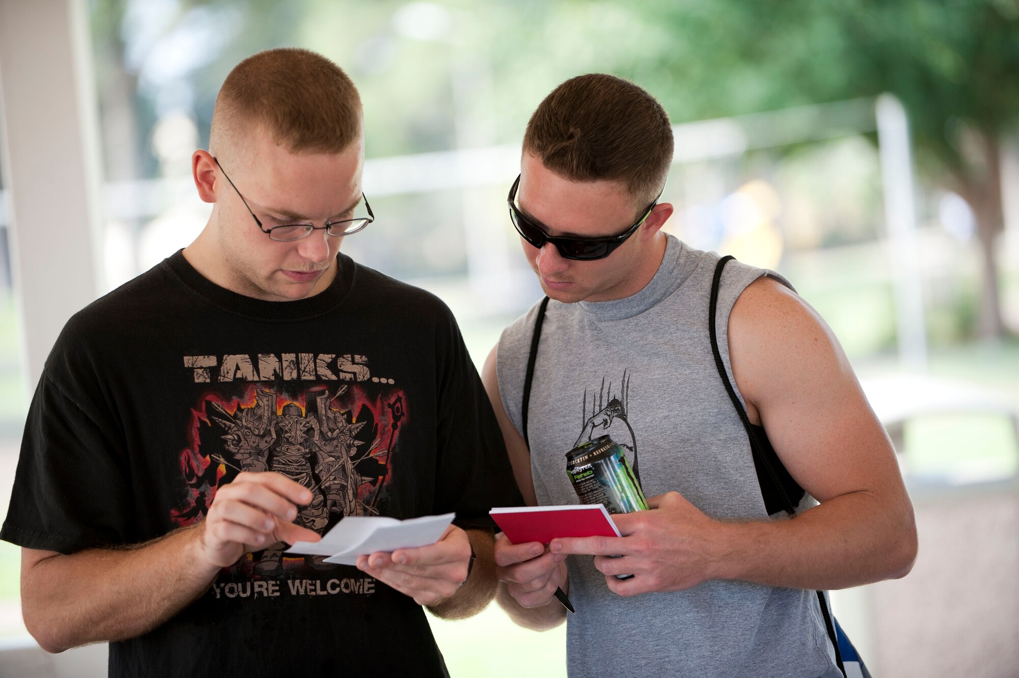 Airman 1st Class Mark Brown, left, and Senior Airman David Pinzon, 39th Medical Support Squadron, work on their first clue during Incirlik's Amazing Race Sept. 22, 2012, at Incirlik Air Base, Turkey. Eight teams traveled across the base and into parts of Adana accomplishing various challenges while competing for first place. The event kicked off Incirlik's Combined Federal Campaign with all team fees going to charity. (U.S. Air Force photo by Senior Airman Clayton Lenhardt/Released)