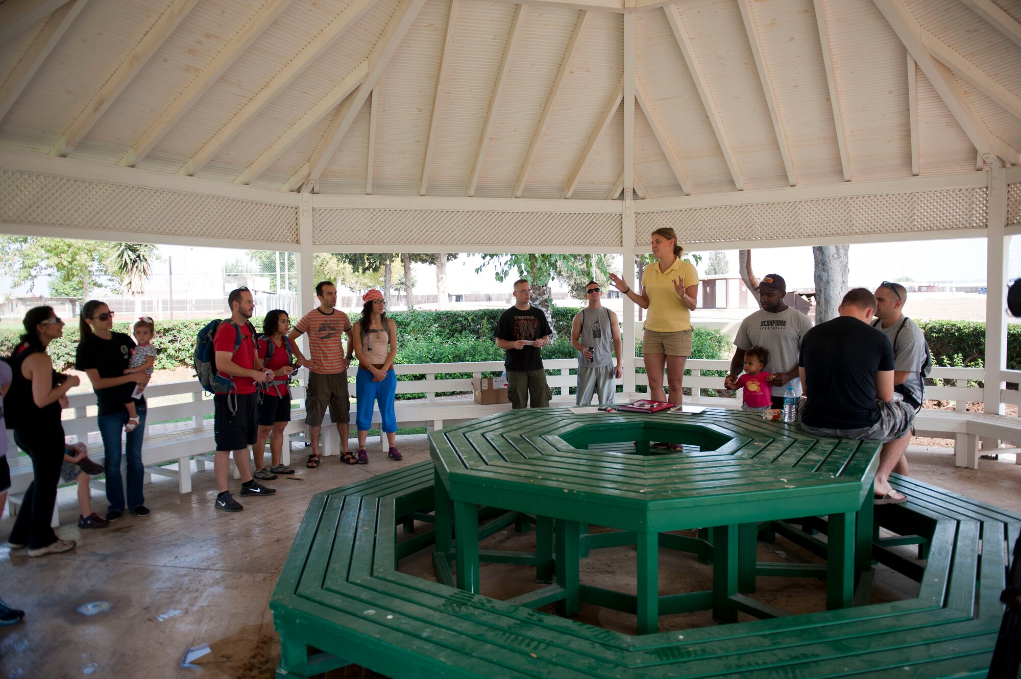 Capt. Mary Mangum, 39th Comptroller Squadron, explains the rules of The Amazing Race Incirlik to participants Sept. 22, 2012, at Incirlik Air Base, Turkey. Eight teams traveled across the base and into parts of Adana accomplishing various challenges while competing for first place. The event kicked off Incirlik's Combined Federal Campaign with all team fees going to charity. (U.S. Air Force photo by Senior Airman Clayton Lenhardt/Released)