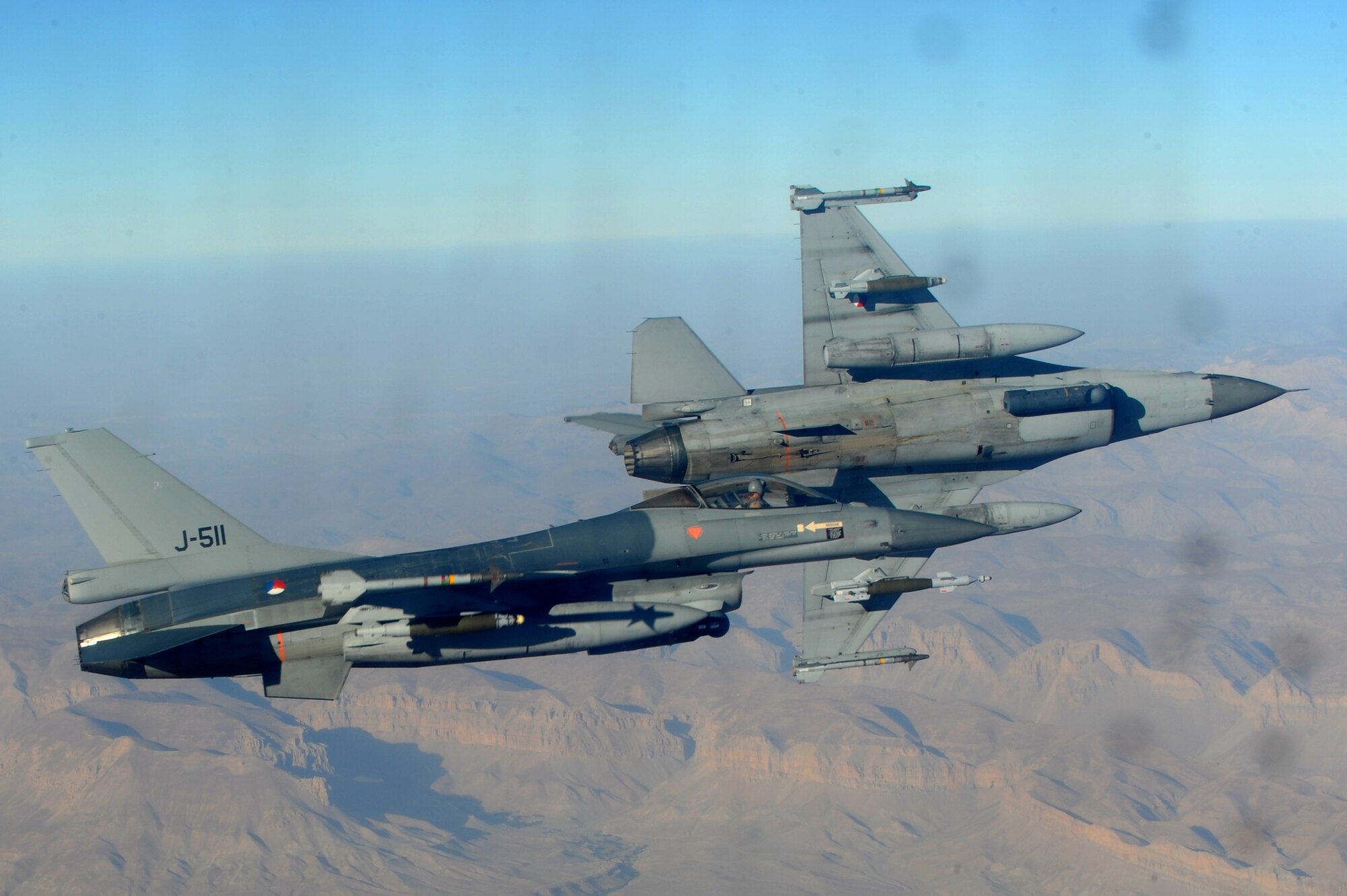 SOUTHWEST ASIA - Two Dutch F-16s fly beside a KC-10 Extender Sept. 18, 2012. The KC-10 can carry 170,000 pounds of cargo and more than 350,000 pounds of fuel.  (U.S. Air Force photo/Master Sgt. Scott MacKay)