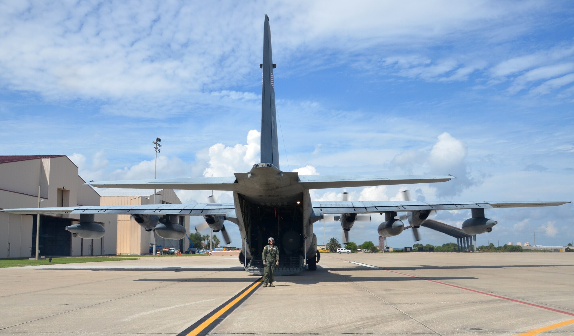 Tech Sgt. Greg Telesh, HC-130P/N King refueling aircraft loadmaster, acts as the gate keeper to the aircraft prior to local media boards. The local media photographed and video recorder the 920th Rescue Wing Pararescue Airmen jumping from the aircraft as well as two HH-60G Pave Hawk helicopters getting refueled by the HC-130. (U.S Air Force photo/Senior Airman Natasha Dowridge)