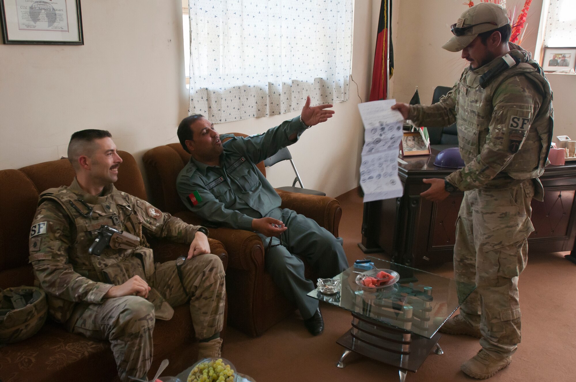 U.S. Air Force Lt. Col. Thomas Sherman, 455th Expeditionary Security Forces Squadron commander, meets with Afghan National Police Col. Haji Azmery, Bagram District Police Chief, at the Bagram District Police headquarters outside Bagram Airfield, Afghanistan, Sept. 22, 2012. Sherman and Azmery work closely together to maintain security around Bagram Airfield. (U.S. Air Force photo/SMSgt Dale Canofari)