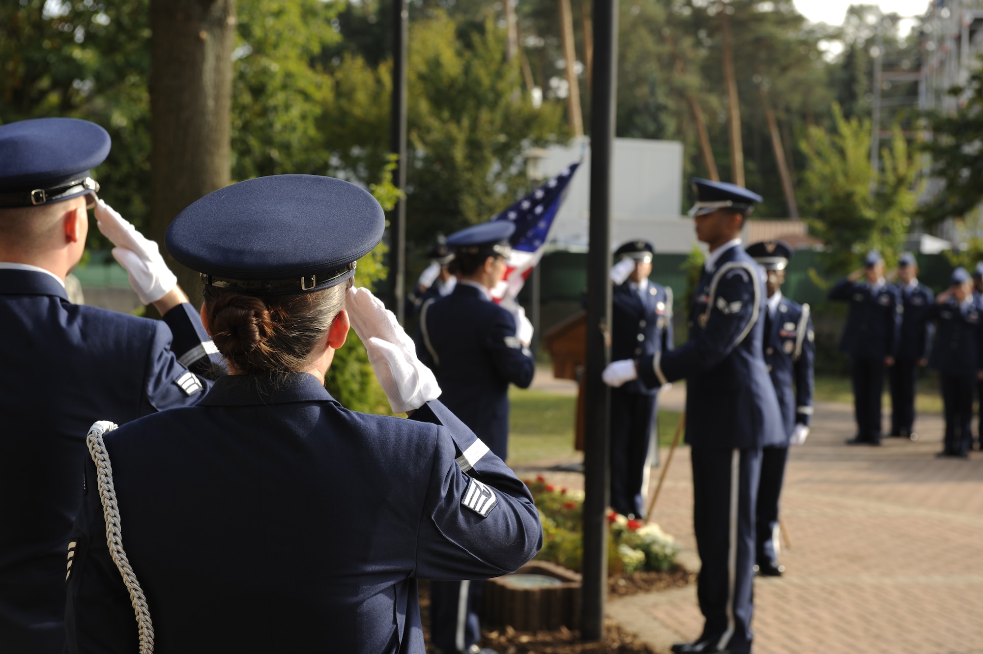 Airmen perform retreat during POW/MIA day at Ramstein, Germany, Sept. 21, 2012. U.S. military members used POW/MIA week to remember the sacrifices and service of our nations POW’s, as well as those who are still MIA. (U.S. Air Force photo/ Senior Airman Aaron-Forrest Wainwright)