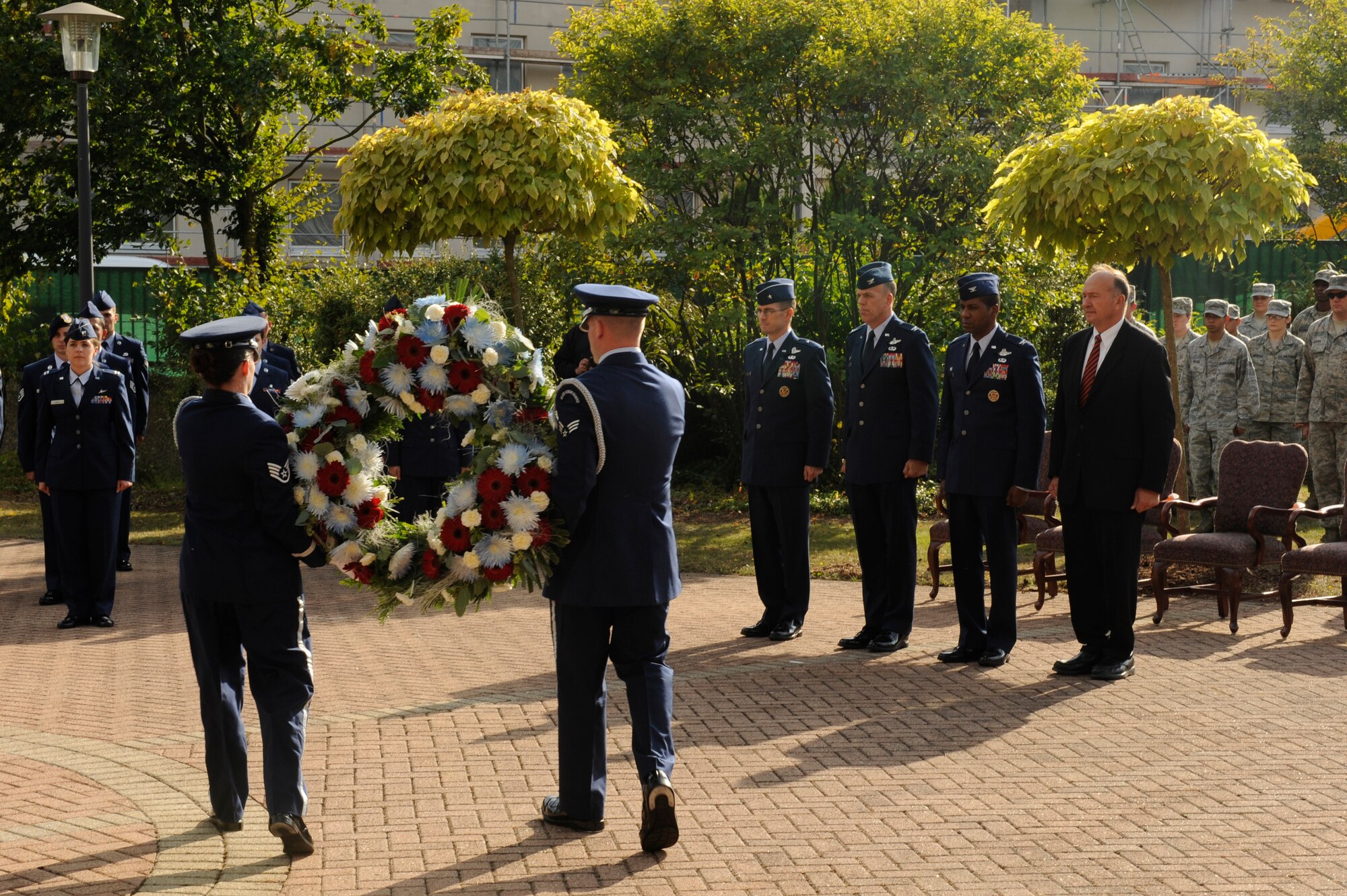 A wreath was presented in front of Capt. (ret.) Guy Gruters, a former prisoner of war, during a ceremony at Ramstein Air Base, Germany, Sept. 21, 2012. U.S. military members used the week to remember the sacrifices and service of our nations POW’s, as well as those who are still MIA. (U.S. Air Force photo/ Senior Airman Aaron-Forrest Wainwright)
