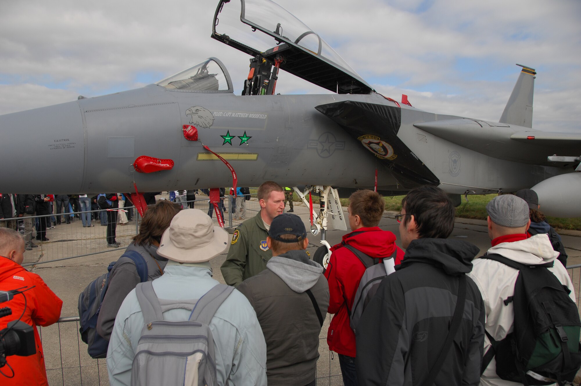 OSTRAVA, Czech Republic—Capt. Aaron Shuett, 493rd Fighter Squadron pilot from Royal Air Force Lakenheath, England, speaks with visitors in front of an F-15C Eagle at the NATO Days military show at the Ostrava Airport Sept. 22. NATO allies joined together at the show where the U.S. Air Force was represented by the F-15C, as well as a C-130 Hercules from Niagara Falls Air Reserve Station, N.Y. and a B-52 Stratofortress from Barksdale Air Force Base, La. More than 220,000 people ventured out to the military show Sept. 22-23. (U.S. Air Force photo by 2nd Lt. Lyndsey Horn)