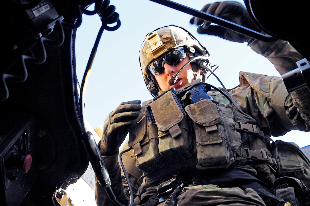 U.S. Army Spc. Lucas Wendeborn conducts an equipment check in his ...