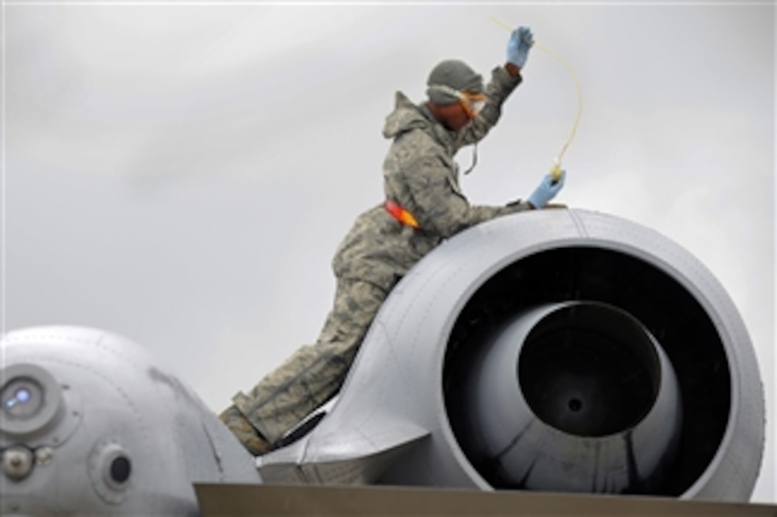 U.S. Air Force Airman 1st Class Tevin Duhart takes a sample of oil from an A-10 Thunderbolt II engine during flight operations at Selfridge Air National Guard Base, Mich., on Aug. 10, 2012.  Duhart is assigned to the 127th Aircraft Maintenance Squadron.  