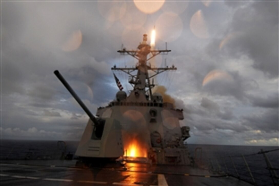 The guided-missile destroyer USS Mustin fires a Standard Missile 2 missile from the ship's forward and aft missile decks during a missile exercise in the Pacific Ocean, Sept. 20, 2012. The Mustin is one of seven guided missile destroyers assigned to Destroyer Squadron 15 and is forward deployed to Yokosuka, Japan. 