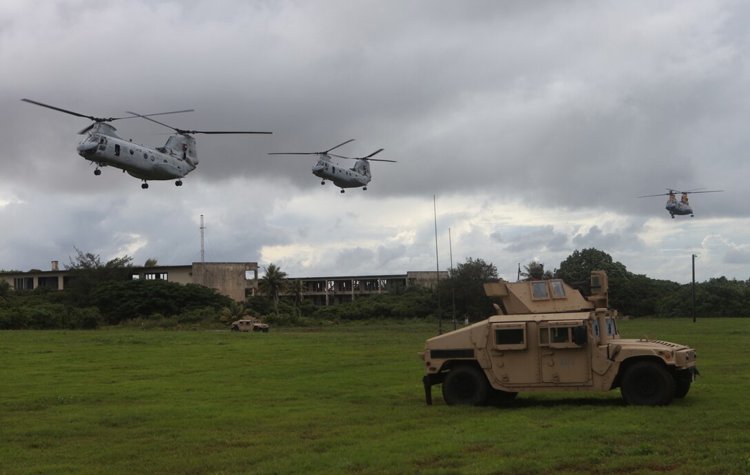 CH-46E Sea Knight helicopters with Marine Medium Helicopter Squadron 262 (Reinforced), 31st Marine Expeditionary Unit, prepare to land with the Battalion Landing Team's Combined Anti-Armor Team providing security here, Sept. 22. Various MEU elements worked in conjunction with the BLT's Company G. during a helicopter-borne assault on a notional enemy-held town during the MEU's certification exercise while deployed throughout the Asia-Pacific region on the yearly-scheduled Fall Patrol. The 31st MEU is the only continuously forward-deployed MEU and is the Marine Corps' force in readiness for the Asia-Pacific region.