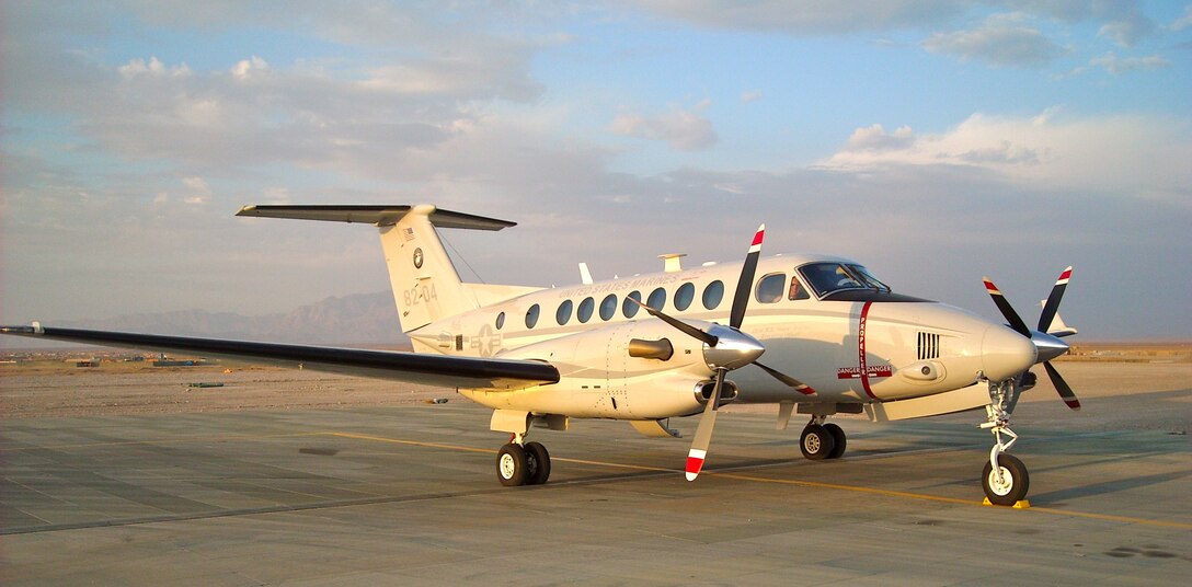 A UC-12W Huron assigned to VMR Belle Chasse, sits on the ramp in Afghanistan. 