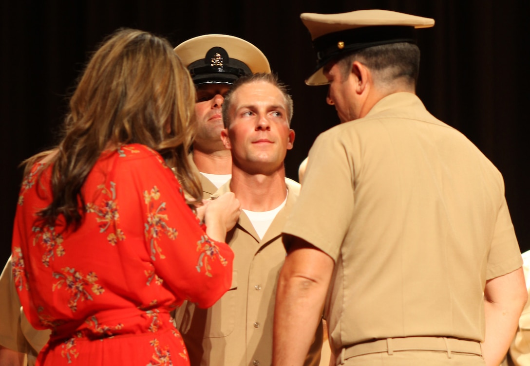 A new chief petty officer has his anchors pinned on aboard Marine Corps Base Camp Lejeune Sept. 14. New chief petty officers typically ask their loved ones and mentors to take part in the ceremony.  