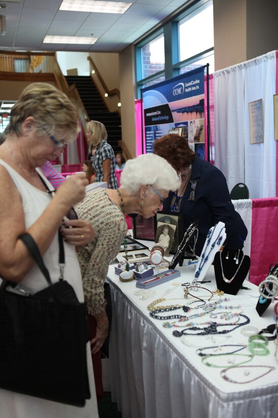 A woman looks over jewelry at the Women's Expo in New Bern, N.C. Sept. 15. The event donated 50 percent of its proceeds to the American Cancer Society.