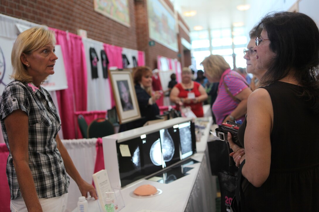 A mammographer speaks to women at the 4th annual Women's Expo about breast health Sept. 15. Displays at the expo highlighted health concerns such as breast-feeding and breast health as well as other issues.