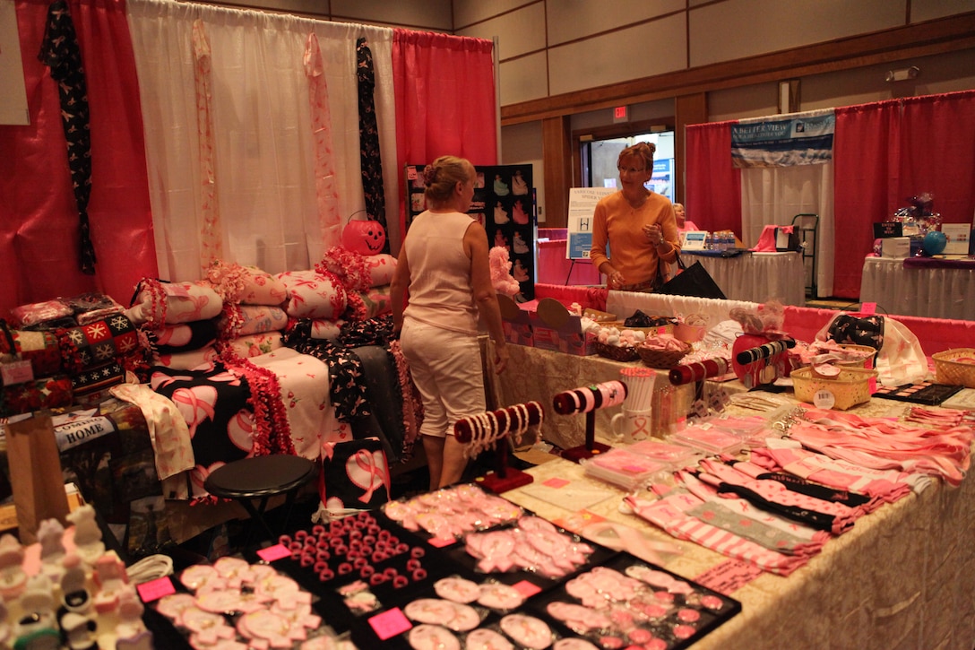 A woman shops at a booth displaying wares that support breast cancer at the 4th annual Women's Expo Sept. 15. Fifty percent of proceeds from the event were donated to the American Cancer Society. 