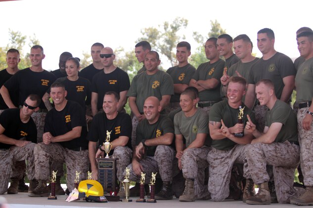 (Left to right) The Marine Corps Air Station Camp Pendleton team, MCAS Miramar team and the MCAS Yuma team pose with their awards after the 2012 Aircraft Rescue Fire Firghting Rodeo held at Lake O'Niel aboard Marine Corps Base Camp Pendleton, Calif., Sept. 22. The over-all winner of the competition was MCAS Camp Pendleton, with a time of 10 minutes, one second, and 25 miliseconds.