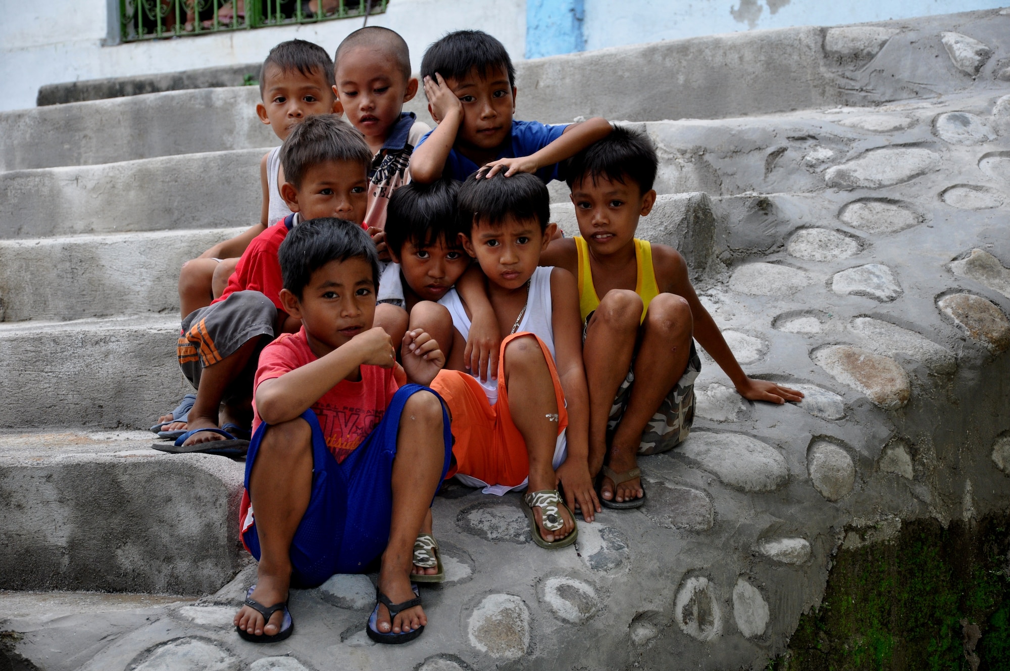 Students of Cacutud Elementary School in Malabacat, Philippines, gather outside the schoolyard Sept. 18. The more than 400 students who attend the school now have renovated classrooms and a new schoolhouse as a result of Airmen from the U.S. Air Force, Philippine Air Force and local contractors who spent the past month working in support of Pacific Unity 12-6. Pacific Unity is a bilateral Engineering Civic Action Program (ENCAP) conducted in the Asia-Pacific region in collaboration with host nation civil authorities and military personnel under the direction and coordination of 13th Air Force, Joint-Based Pearl Harbor-Hickam, Hawaii. (U.S. Air Force photo by 2nd Lt. Sarah Bergstein/Released).