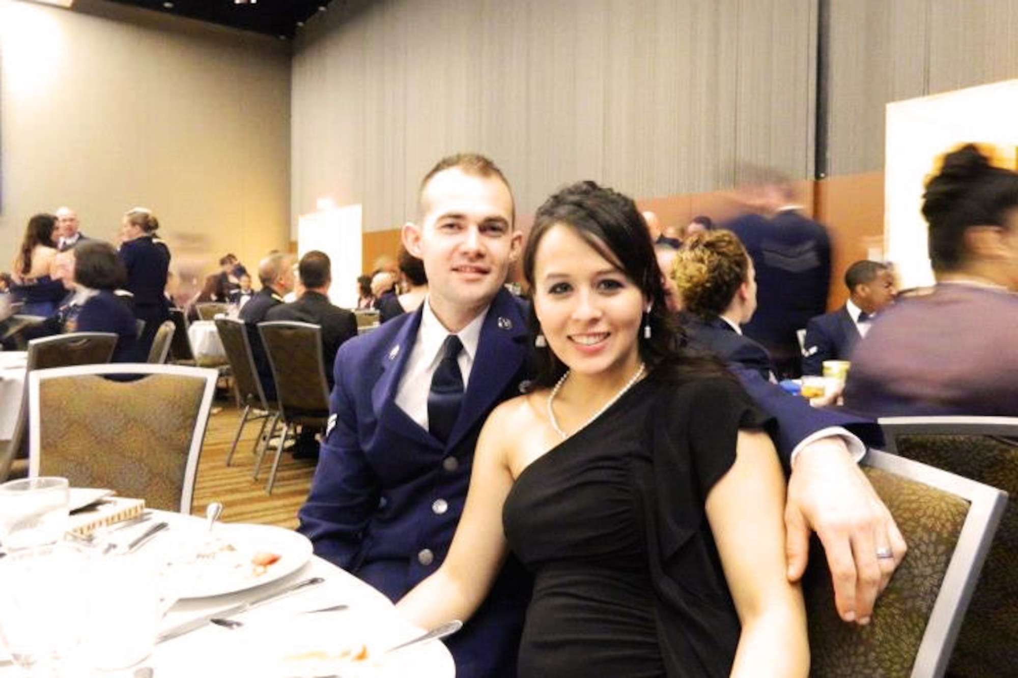 Airman 1st Class Nathaniel Apeland and his wife, Amanda, pose for a photo at the Air Force ball recently. The Apelands are involved in international assistance. (Courtesy photo)