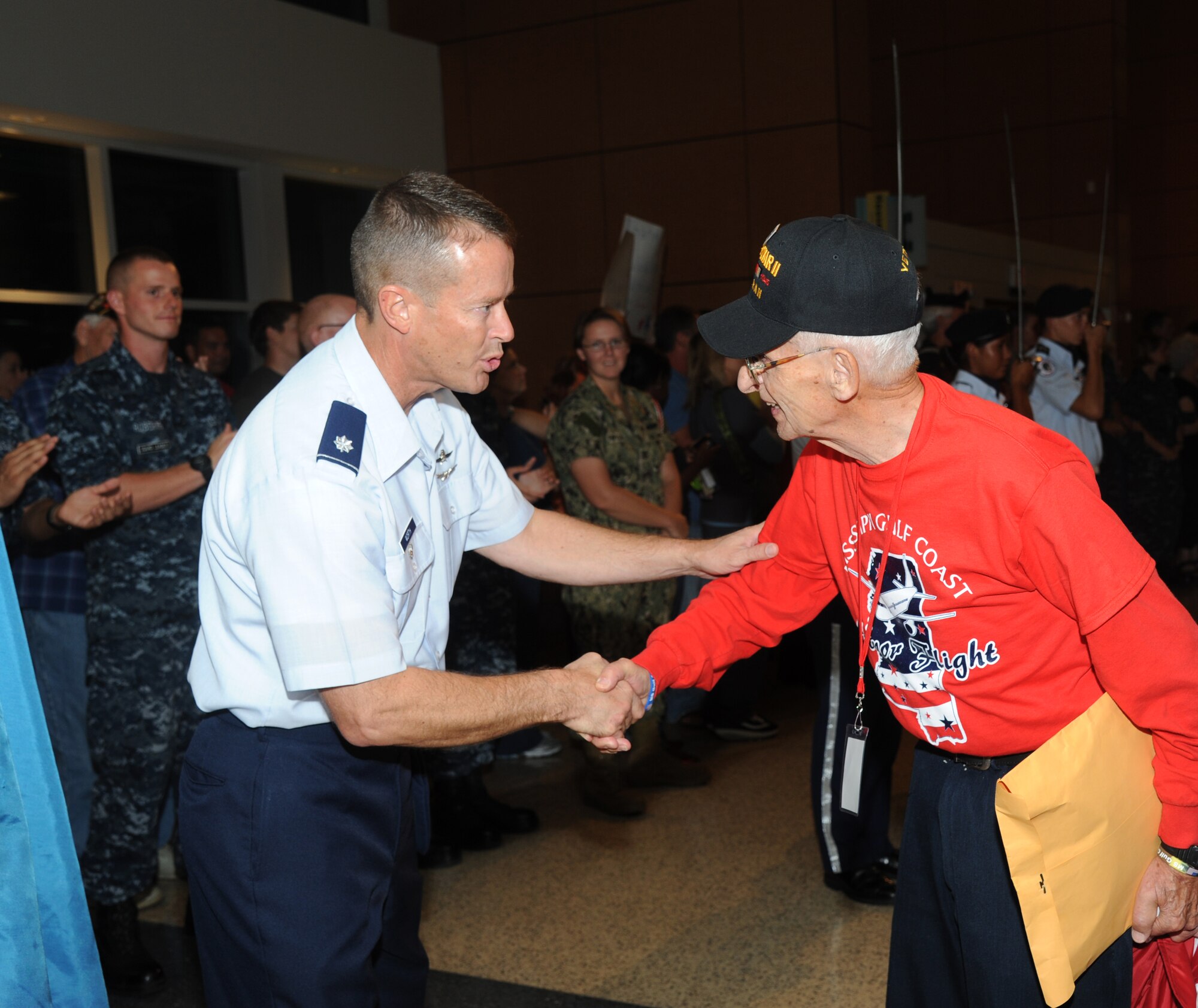 Lt. Col. Brian Worth, 81st Training Group deputy commander, Keesler Air Force Base, Miss., thanks Navy veteran, Robert Everard, for his service and the time he served in the W.W. II and Korean War, at the fourth  Mississippi Gulf Coast Honor Flight to Washington, D.C., Sept 25, 2012, at the Gulfport/Biloxi International Airport. The Honor Flight program receives donations to honor our nation’s World War II veterans by sending them on a one-day visit to Arlington National Cemetery in Washington, D.C. (U.S. Air Force photo by Kemberly Groue)
