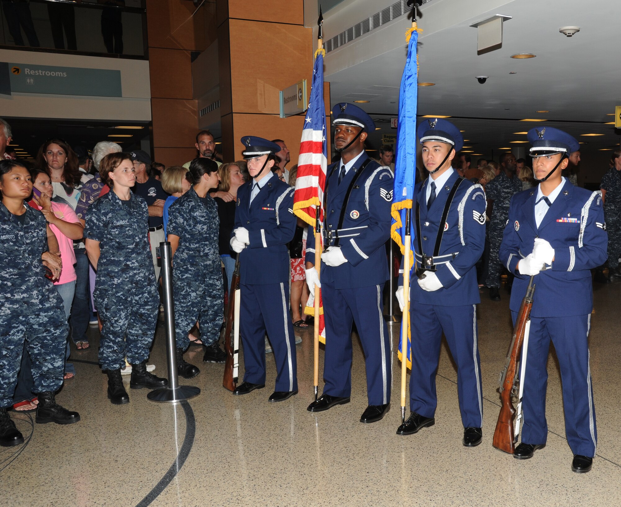 Members of the Keesler Air Force Base Honor Guard, stand at attention awaiting the arrival of WWII veterans at the fourth  Mississippi Gulf Coast Honor Flight to Washington, D.C., Sept 25, 2012, at the Gulfport/Biloxi International Airport. The Honor Flight program receives donations to honor our nation’s World War II veterans by sending them on a one-day visit to Arlington National Cemetery in Washington, D.C.  (U.S. Air Force photo by Kemberly Groue)