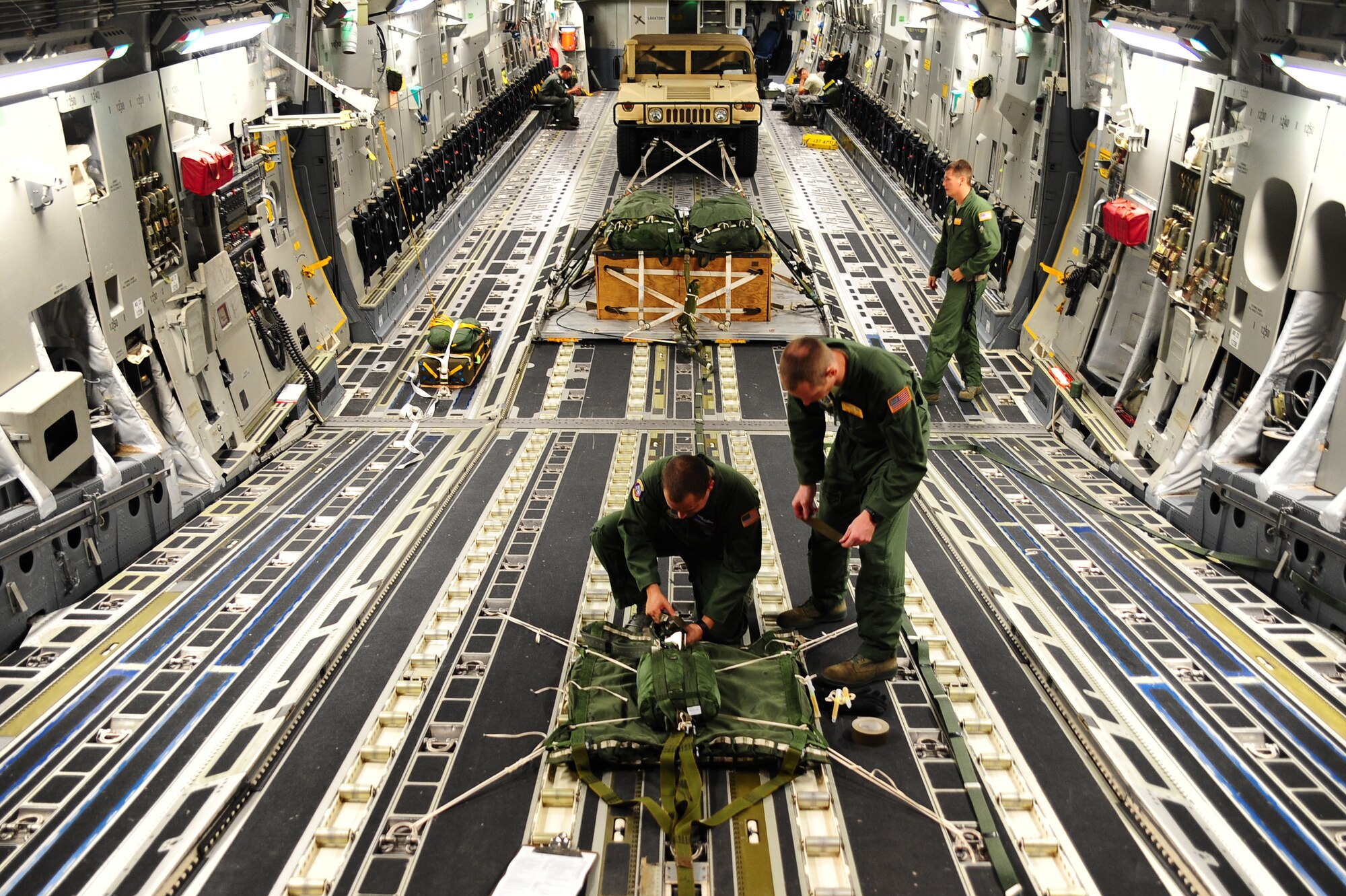 Senior Airman Brandon Killen, 437th Operations Support Squadron loadmaster, inspects an extraction package Sept. 24, 2012, at Joint Base Charleston - Air Base, S.C. The 437th OSS provides flying operations support to the 437th and 315th Airlift Wings. They are directly responsible for airfield management, life support services, flight records management, weather and intelligence support, airlift scheduling, tactical employment and aircrew training for approximately 1,400 active duty and Reserve personnel. (U.S. Air Force photo/ Airman 1st Class Chacarra Walker)