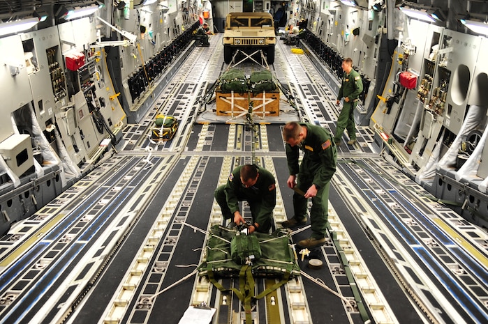 Senior Airman Brandon Killen, 437th Operations Support Squadron loadmaster, inspects an extraction package Sept. 24, 2012, at Joint Base Charleston - Air Base, S.C. The 437th OSS provides flying operations support to the 437th and 315th Airlift Wings. They are directly responsible for airfield management, life support services, flight records management, weather and intelligence support, airlift scheduling, tactical employment and aircrew training for approximately 1,400 active duty and Reserve personnel. (U.S. Air Force photo/ Airman 1st Class Chacarra Walker)