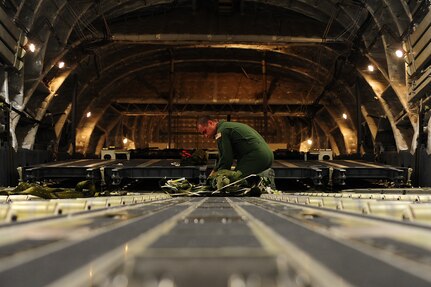 Senior Airman Brandon Killen, 437th Operations Support Squadron loadmaster, inspects an extraction package Sept. 24, 2012, at Joint Base Charleston - Air Base, S.C. The 437th OSS provides flying operations support to the 437th and 315th Airlift Wings. They are directly responsible for airfield management, life support services, flight records management, weather and intelligence support, airlift scheduling, tactical employment and aircrew training for approximately 1,400 active duty and Reserve personnel. (U.S. Air Force photo/ Airman 1st Class Chacarra Walker)