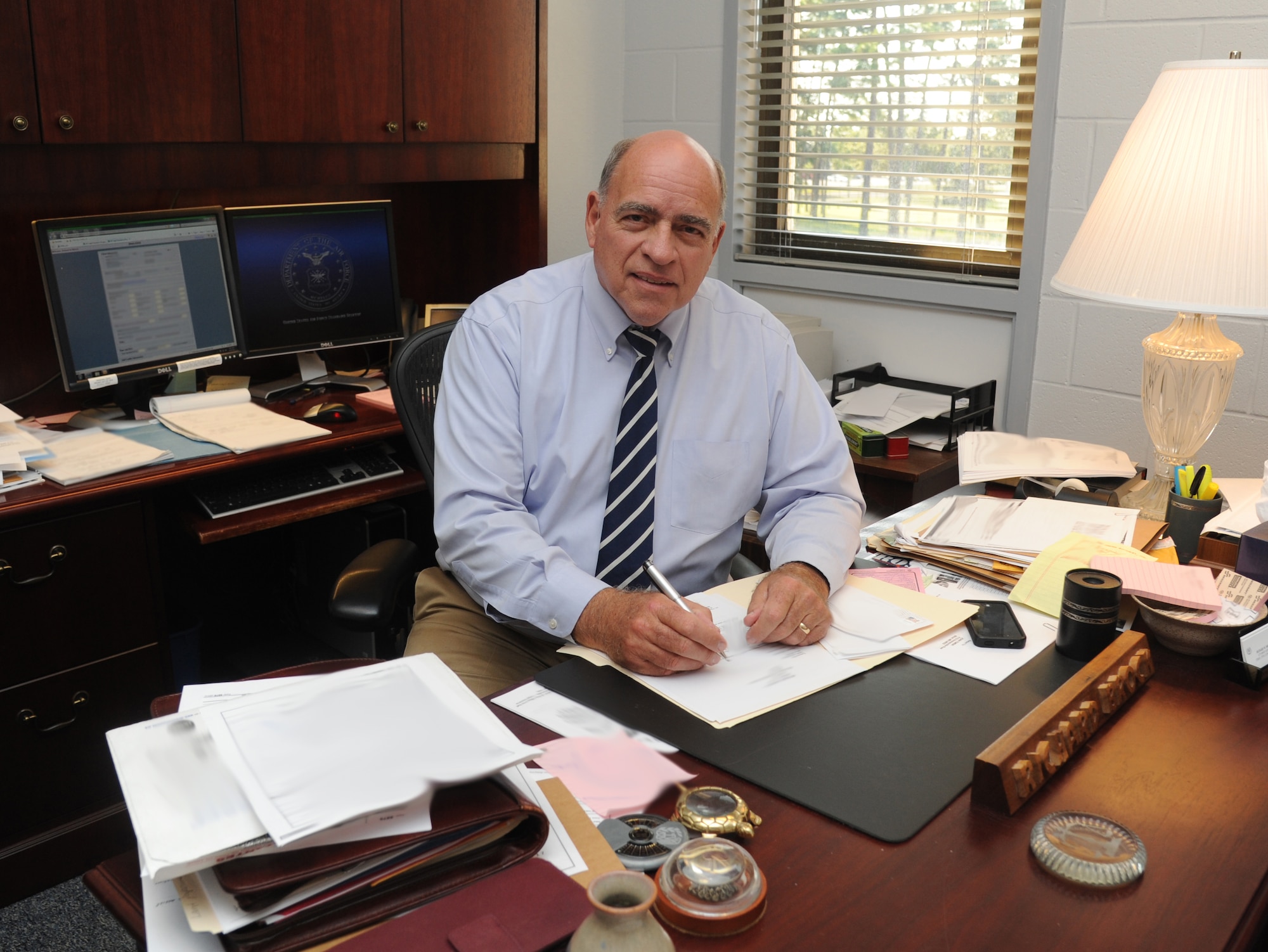 Richard Brock, 81st Training Wing attorney advisor and civil law division chief, reviews legal documents in his office Sept. 25, 2012, at the Sablich Center, Keesler Air Force Base, Miss. (U.S. Air Force photo by Kemberly Groue)