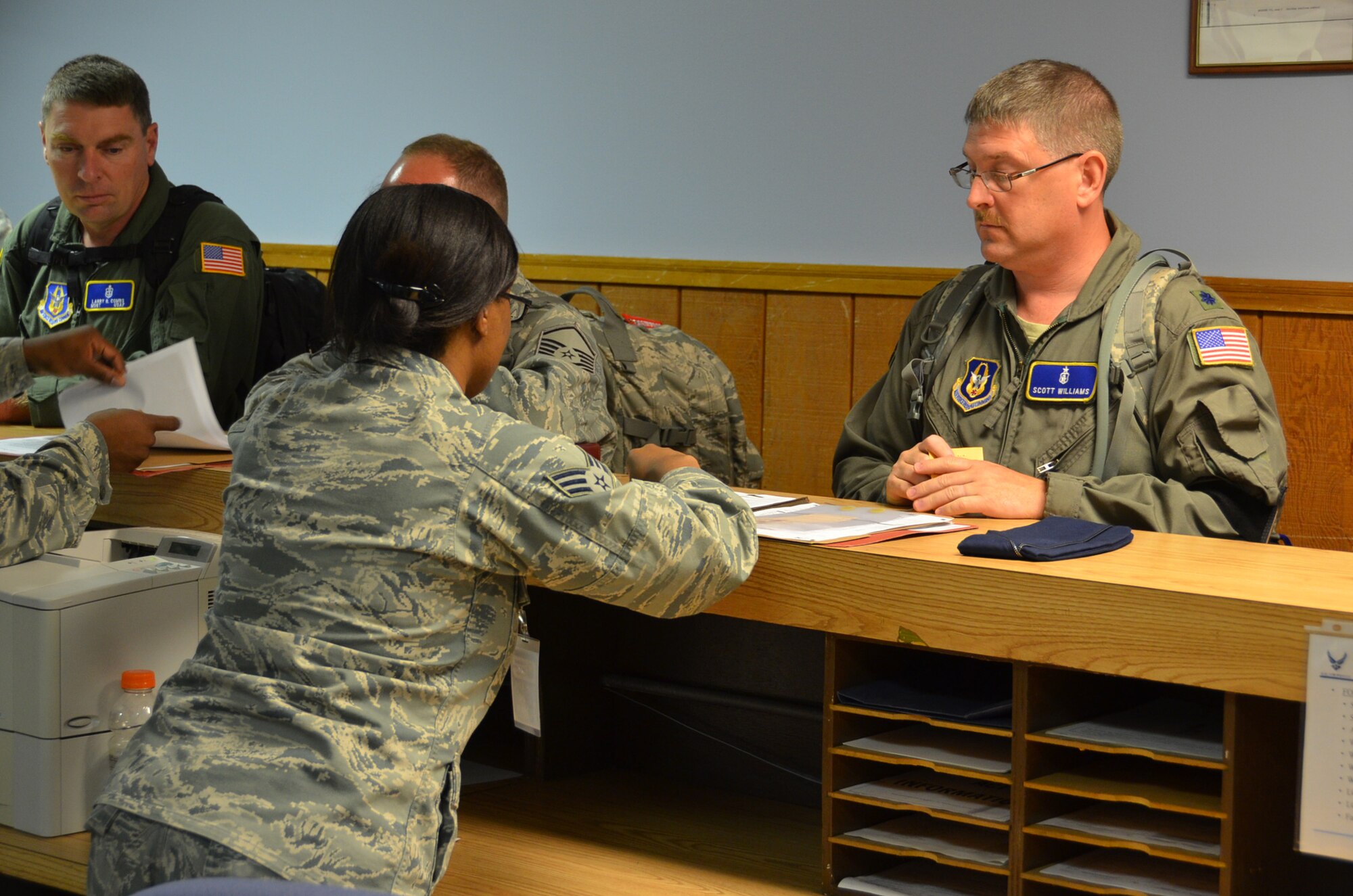 WRIGHT-PATTERSON AIR FORCE BASE, Ohio - Lt. Col. Scott Williams, 445th Aeromedical Staging Squadron clinical nurse, has his mobility folder checked here Sept. 17 by Senior Airman Va’Nesa Young, 88th Force Support Squadron, prior to his departure in support of the wing’s Operational Readiness Exercise held in Gulfport, Miss. (U.S. Air Force photo/Staff Sgt. Robert Nelson)