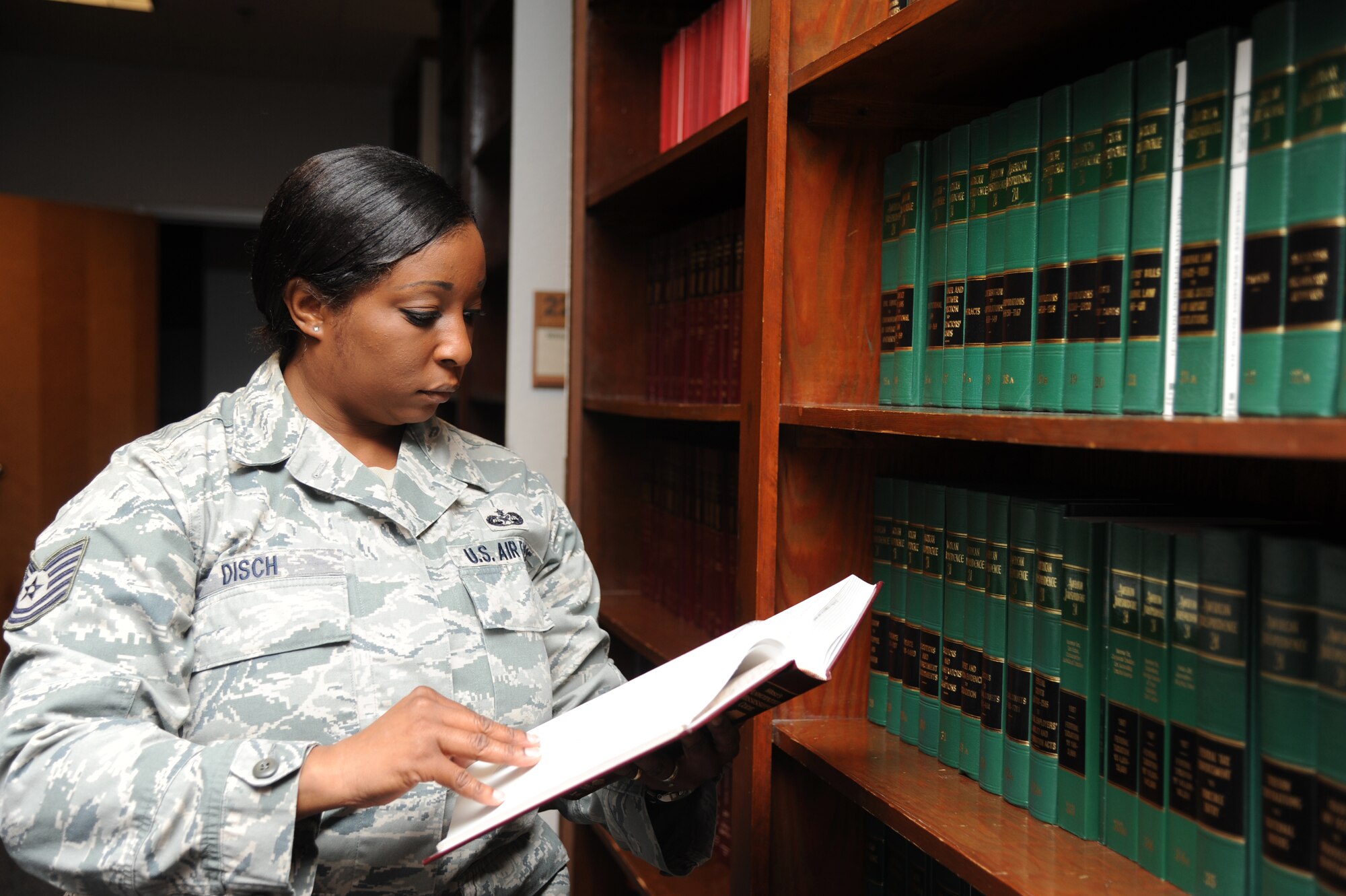 Tech. Sgt. Jennifer Disch, 81st Training Wing general law noncommissioned officer in charge, does legal research in Mississippi Code Sept. 25, 2012, at the Sablich Center, Keesler Air Force Base, Miss. (U.S. Air Force photo by Kemberly Groue)