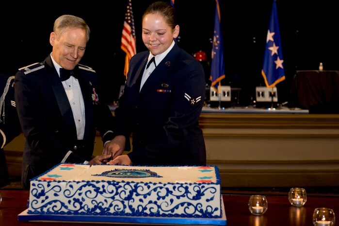 U.S. Air Force Col. Gary Braun, 99th Dental Squadron commander, and Airman 1st Class Kelly Koch, 57th Maintenance Squadron munitions systems apprentice, cut the cake at the Air Force Ball celebrating the 65th anniversary of the United States Air Force Sep. 22, 2012 in Las Vegas, Nev. The Air Force Ball is held annually to celebrate the Sep. 18, 1947 creation of the U.S. Air Force. (U.S. Air Force photo by Airman 1st Class Christopher Tam)