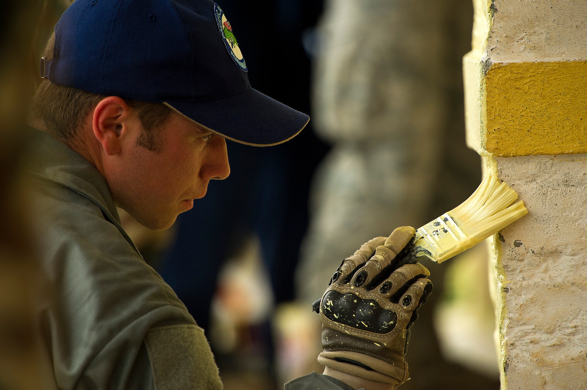 Airman 1st Class Jace McCarthy, 354th Civil Engineer Squadron, Eielson Air Force Base, Alaska, paints the outside of a school building during U.S. Pacific Command's Operation Pacific Angel 12-4, Nepal, Sept. 10, 2012. McCarthy is a member of a team of U.S. Air Force and Nepalese army civil engineers renovating and constructing buildings of the Machhapuchhre Higher Secondary School of Dhikur Pokhari Village Development Committee. Pacific Angel 12-4 is a Pacific Air Forces planned event that enhances humanitarian assistance and disaster relief capabilities between the United States and Pacific partners. The U.S. was invited by the Nepal government to provide support by conducting medical, optometry and civil engineering programs. Operations like Pacific Angel build and sustain relationships with multinational partners in the Asia-Pacific region. (U.S. Air Force photo/Master Sgt. Jeffrey Allen)