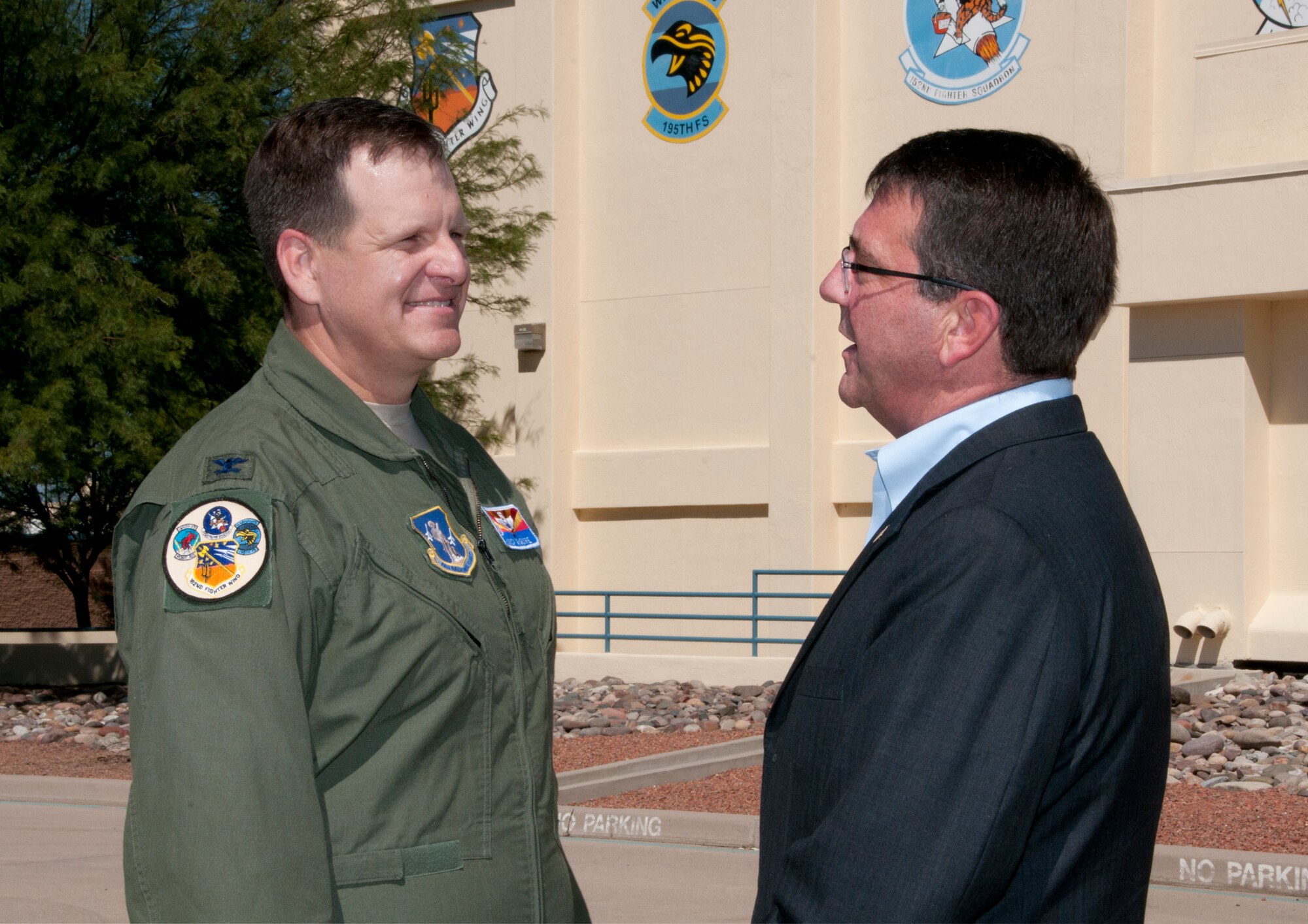 Col. Mick McGuire, 162nd Fighter Wing commander, gives Dr. Ashton Carter, Deputy Defense Secretary, a view of the wing’s flightline at Tucson International Airport Sept. 26.  Dr. Carter visited the Arizona Air National Guard’s F-16 international training program during a tour of Tucson military installations. (U.S. Air Force photo/MSgt David Neve)