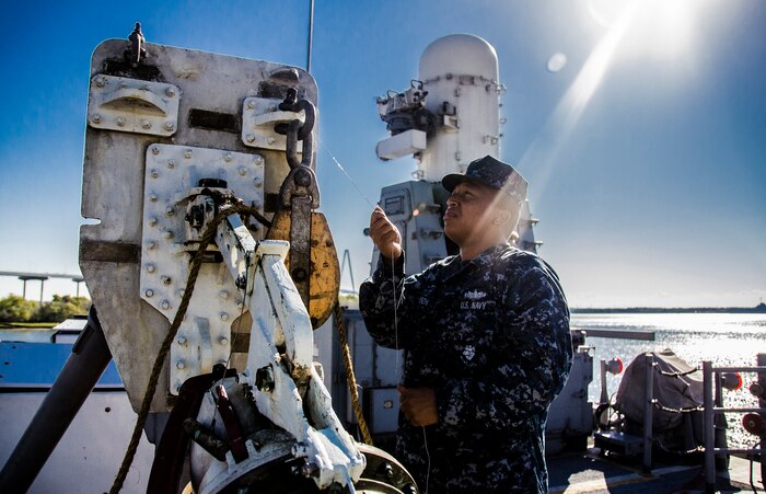Seaman Charleston Johnson, prepares a refueling station onboard the guided missile frigate USS Nicholas (FFG 47) while the ship is moored pier side during a routine port visit Sept. 24, 2012, at the Charleston Port Terminal, Charleston, S.C. The refueling station is used to receive fuel during an underway replenishment while the ship is at sea. (U.S. Air Force Photo / Airman 1st Class Tom Brading)