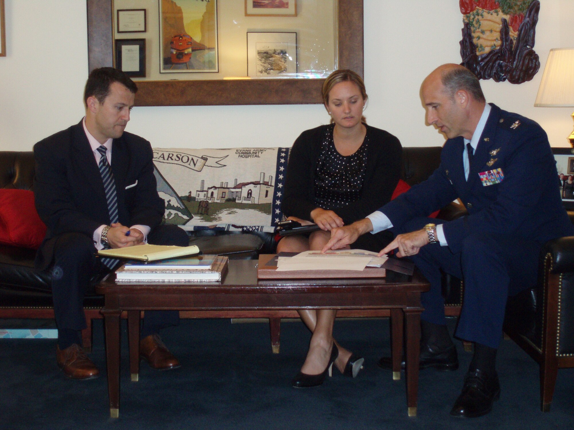 WASHINGTON -- On right, Col. Jeffrey Mineo, 310th Space Wing commander, talks to Military Legislative Assistant, Leslie Campbell, and Military Legislative Fellow, Brad Brewington, from Congressman Doug Lamborn's office, about the wing's mission and contributions to national defense Sept. 20.
(U.S. Air Force Photo by Lt. Col. Cindy East)
