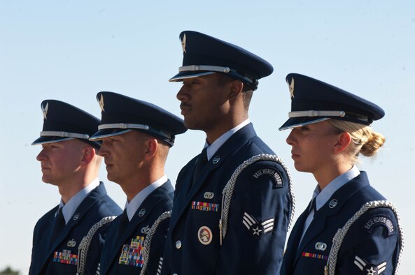 Staff Sgt. Michael Marr, Tech. Sgt. Michael Lewis, Senior Airman Terrell Gray, and Airman 1st Class Tonya Criss, from the Ellsworth Air Force Base Honor Guard stand at the ready during a Prisoner of War, Missing in Action Remembrance retreat ceremony at Ellsworth Air Force Base, S.D., 2012. The base Honor Guard is responsible for providing military honors throughout a 114,636 square mile area covering South Dakota, western Nebraska and northern Wyoming. (U.S. Air Force photo by Airman 1st Class Zachary Hada/Released)