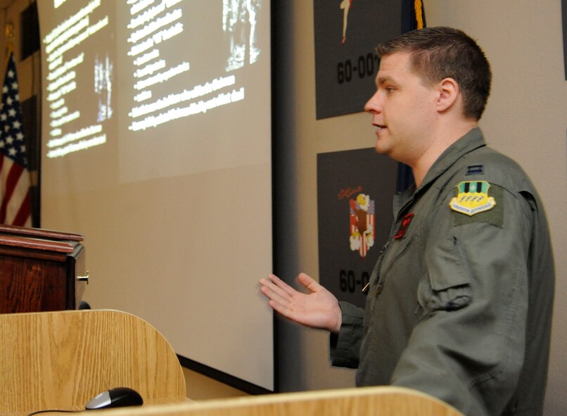 Capt. Christopher Cox, 96th Bomb Squadron scheduling flight commander, speaks during a mentorship briefing on Barksdale Air Force Base, La., Sept. 26. The briefing is part of a mentorship program named "Under the Devil's Wing", in which the objective is to better integrate newcomers to the 96 BS and produce more effective aviators. (U.S. Air Force photo/Airman 1st Class Andrew Moua)(RELEASED)
