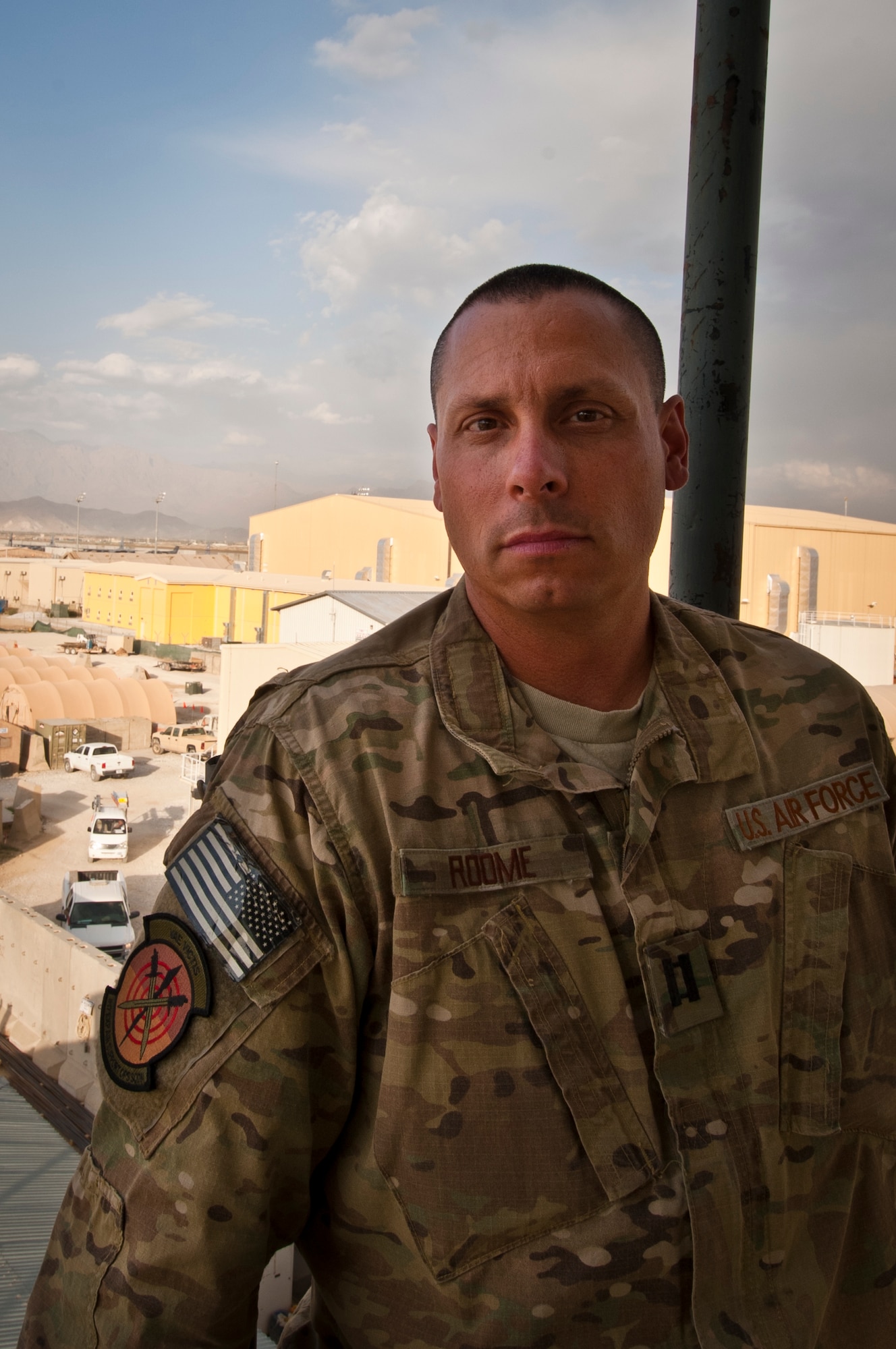 Capt. Christopher Roome, a Space Liaison Officer tasked to support Combined Joint Task Force-1, stands atop the old Russian Tower at Bagram Airfield, Afghanistan, September 25, 2012. Roome advises and educates ground commanders on available space-based assets to enable successful operations. (U.S. Air Force Photo/Capt. Raymond Geoffroy)