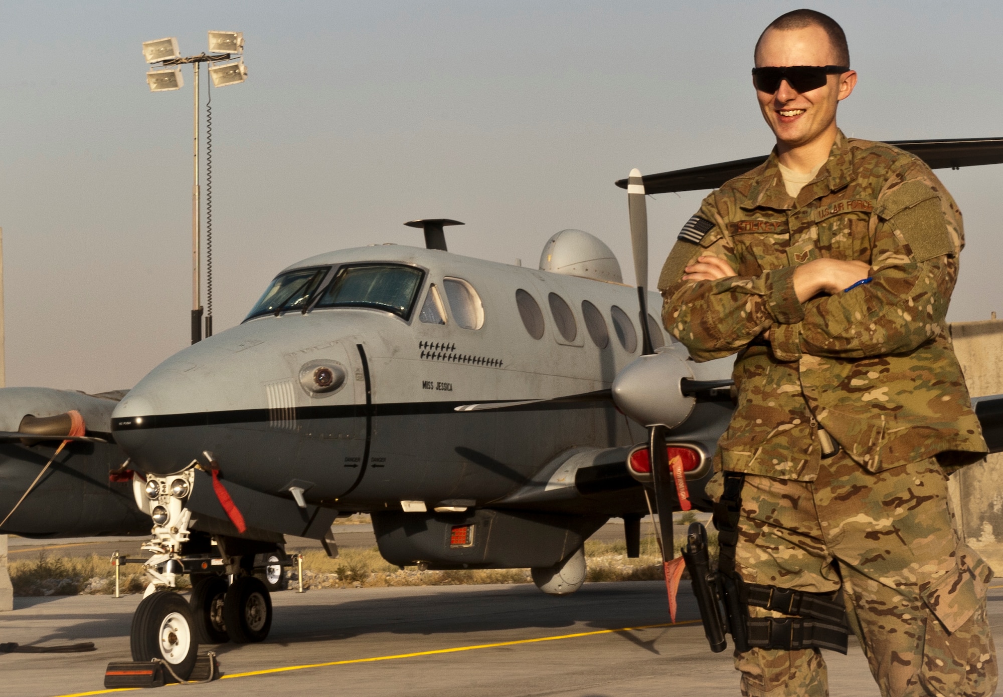 SSgt Garrick Stilkey, Regional Command-East Intelligence Surveillance Reconnaissance Logistics Officer, stands in front of a MC-12 liberty at Bagram Airfield, Afghanistan, September 3, 2012. Stilkey enables the integration of available ISR assets into ground operations in eastern Afghanistan. (U.S. Air Force Photo/Capt. Raymond Geoffroy)