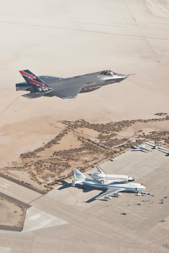 An F-35 Lightning II flies over Space Shuttle Endeavour Sept. 20. The space shuttle
landed at Edwards after completing the fourth leg of its ferry flight to the California Science Center in Los Angeles, Calif. (Courtesy photo by Matthew Short/Lockheed Martin)