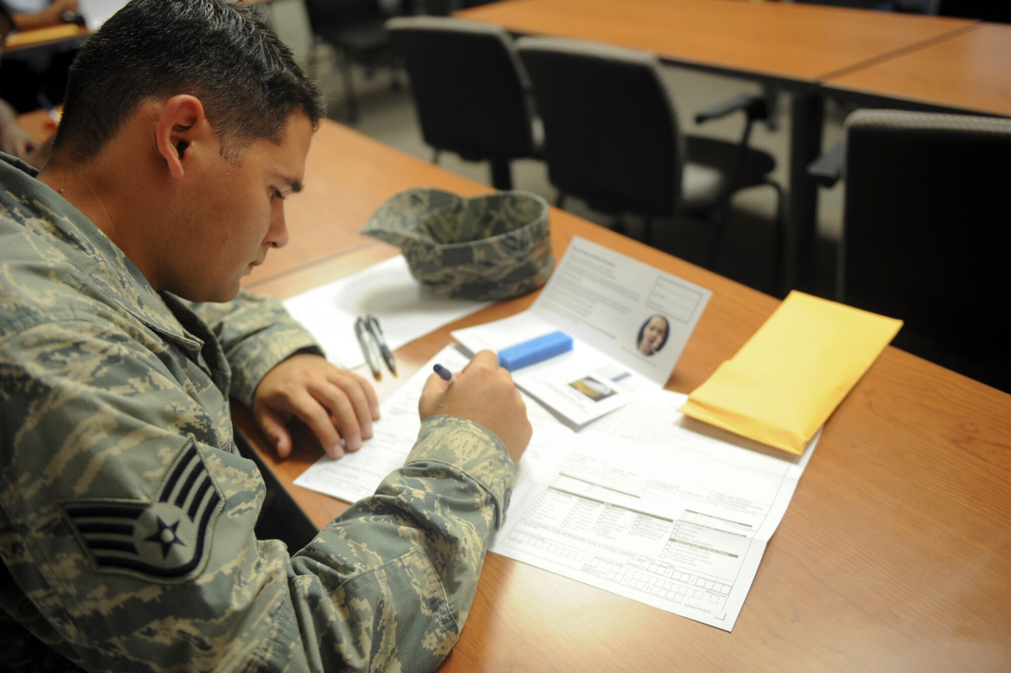 U.S. Air Force Staff Sgt. Charles Harris, 23d Component Maintenance Squadron aerospace propulsion craftsman, fills out a donor information form during Moody’s Bone Marrow Drive at Moody Air Force Base, Ga., Sept. 24, 2012. Once registered, the donor information will remain in the registry until their 61st birthday. (U.S. Air Force photo by Senior Airman Douglas Ellis/Released)
