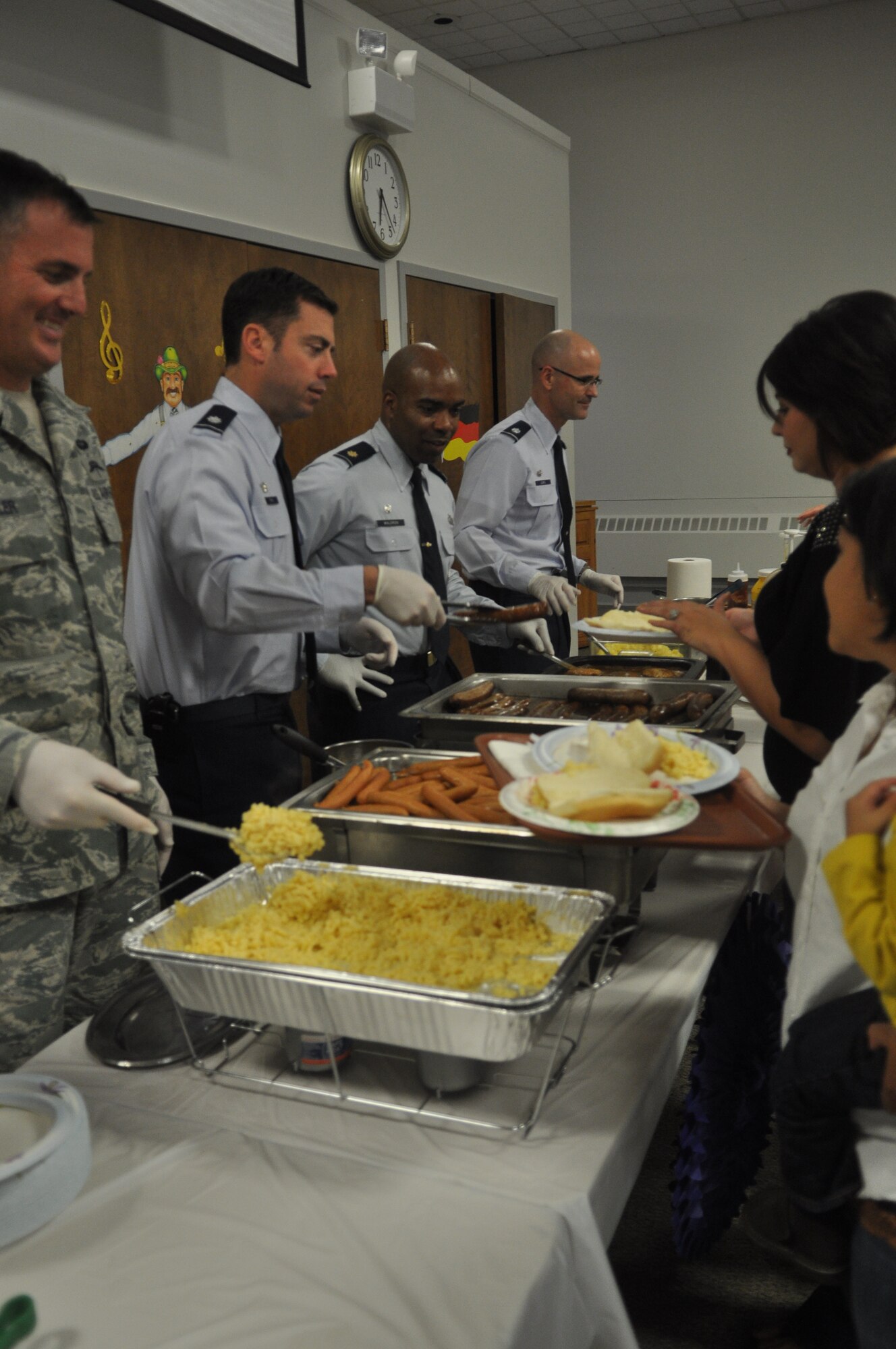 Leaders of McChord Field serve dinner to families of deployed Airmen at the Chapel Support Center, Sept. 24, 2012 at Joint Base Lewis-McChord, Wash. The event is a quarterly event for family members of deployed Airmen to get together for sharing of stories and comraderie. (U.S. Air Force photo/Staff Sgt. Sean Tobin)