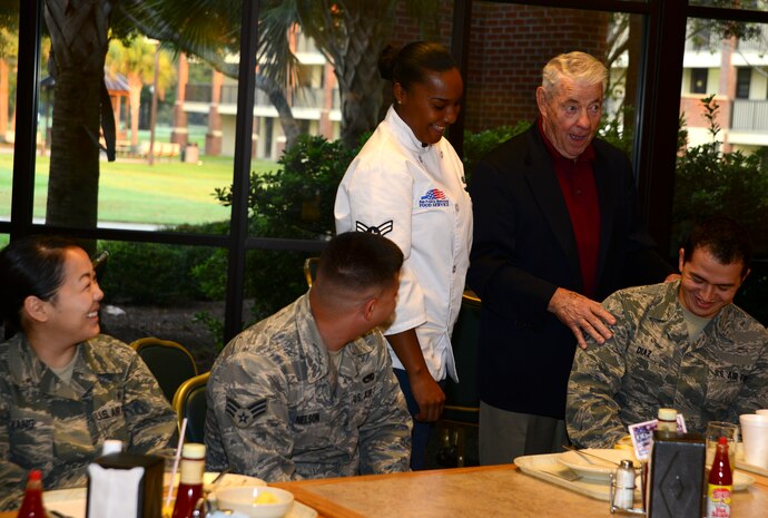 Retired Chief Master Sgt. of the Air Force Robert Gaylor shares a laugh with Airmen during breakfast at the Robert D. Gaylor dining facility, Sept. 21, 2012, at Joint Base Charleston - Air Base, S.C. Gaylor shared his insights about the Air Force, both past and present, with JB Charleston Airmen. (U.S. Air Force photo/Staff Sgt. Rasheen Douglas)